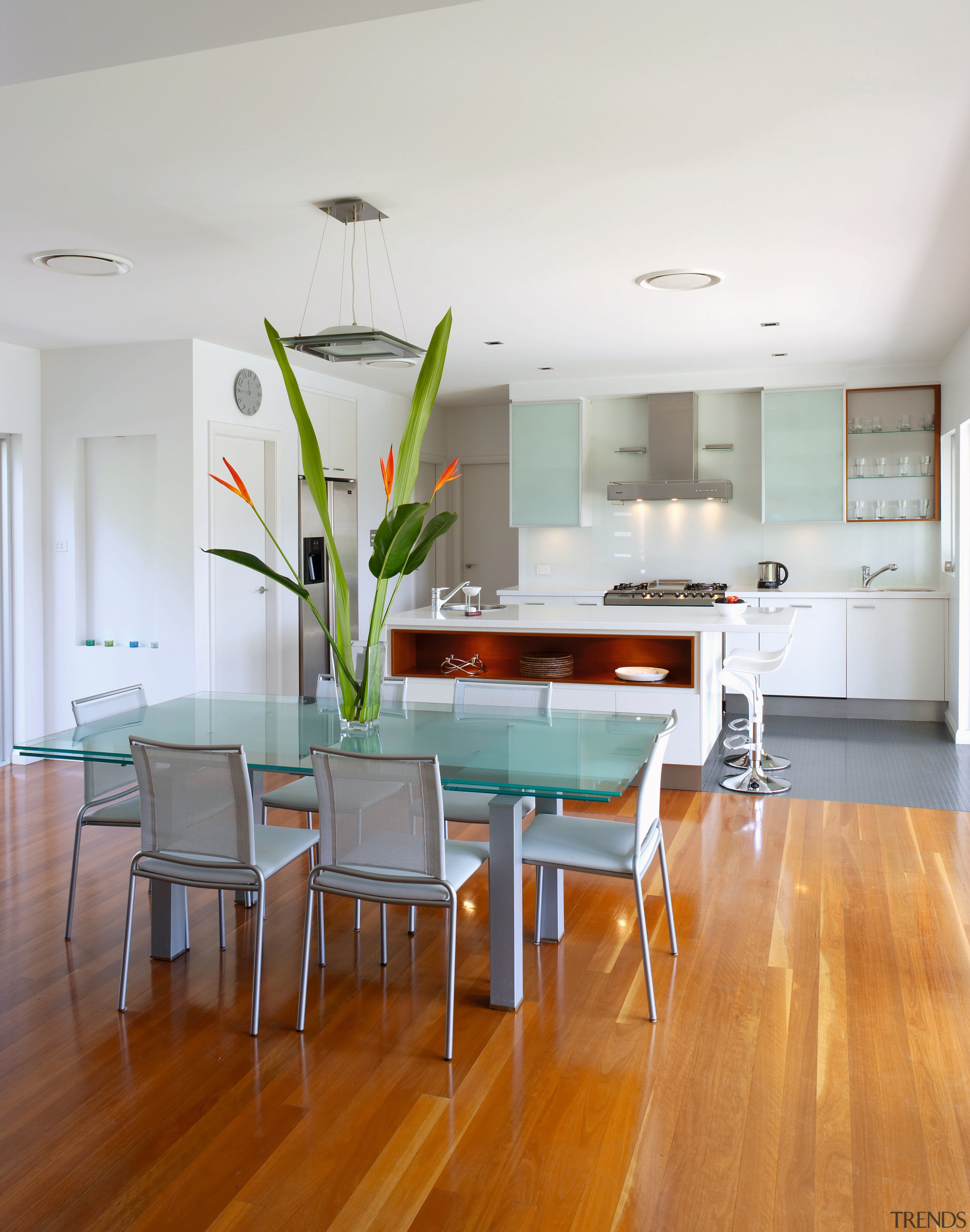 View of the dining and kitchen areas of ceiling, dining room, floor, flooring, furniture, hardwood, house, interior design, kitchen, laminate flooring, living room, real estate, room, table, wood, wood flooring, white, gray