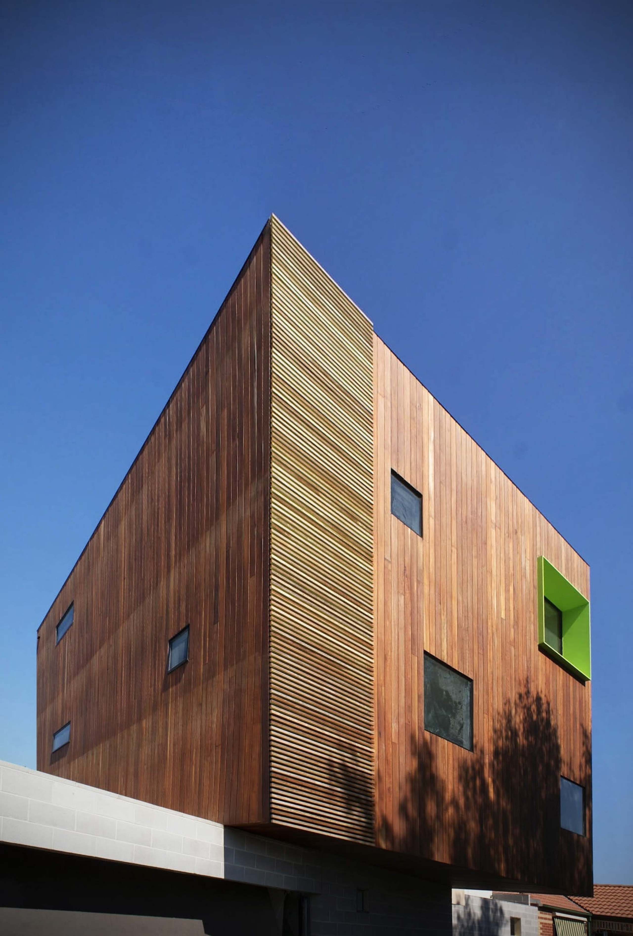 This green inset breaks up the wood - architecture, building, daylighting, facade, house, siding, sky, wall, wood, blue
