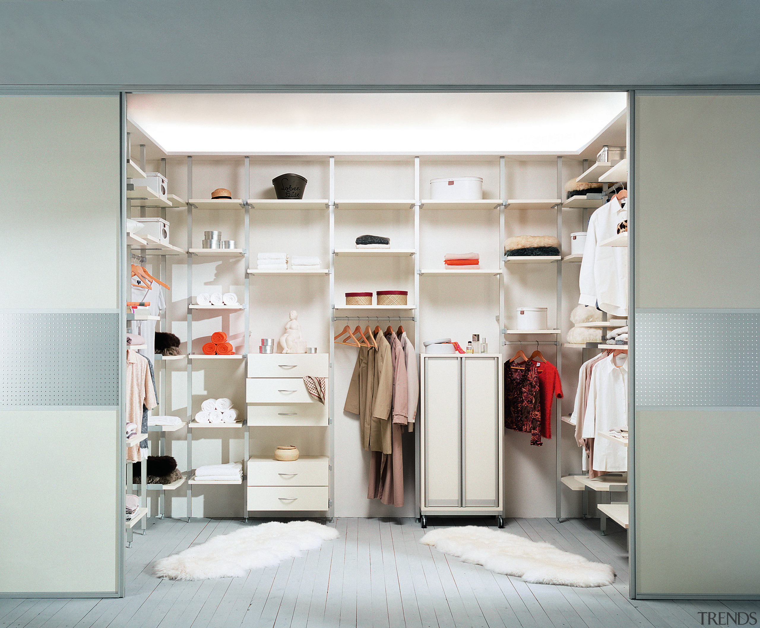 A view of a wordrobe by Innovative Interiors. closet, furniture, interior design, product design, room, shelf, shelving, wardrobe, white, gray