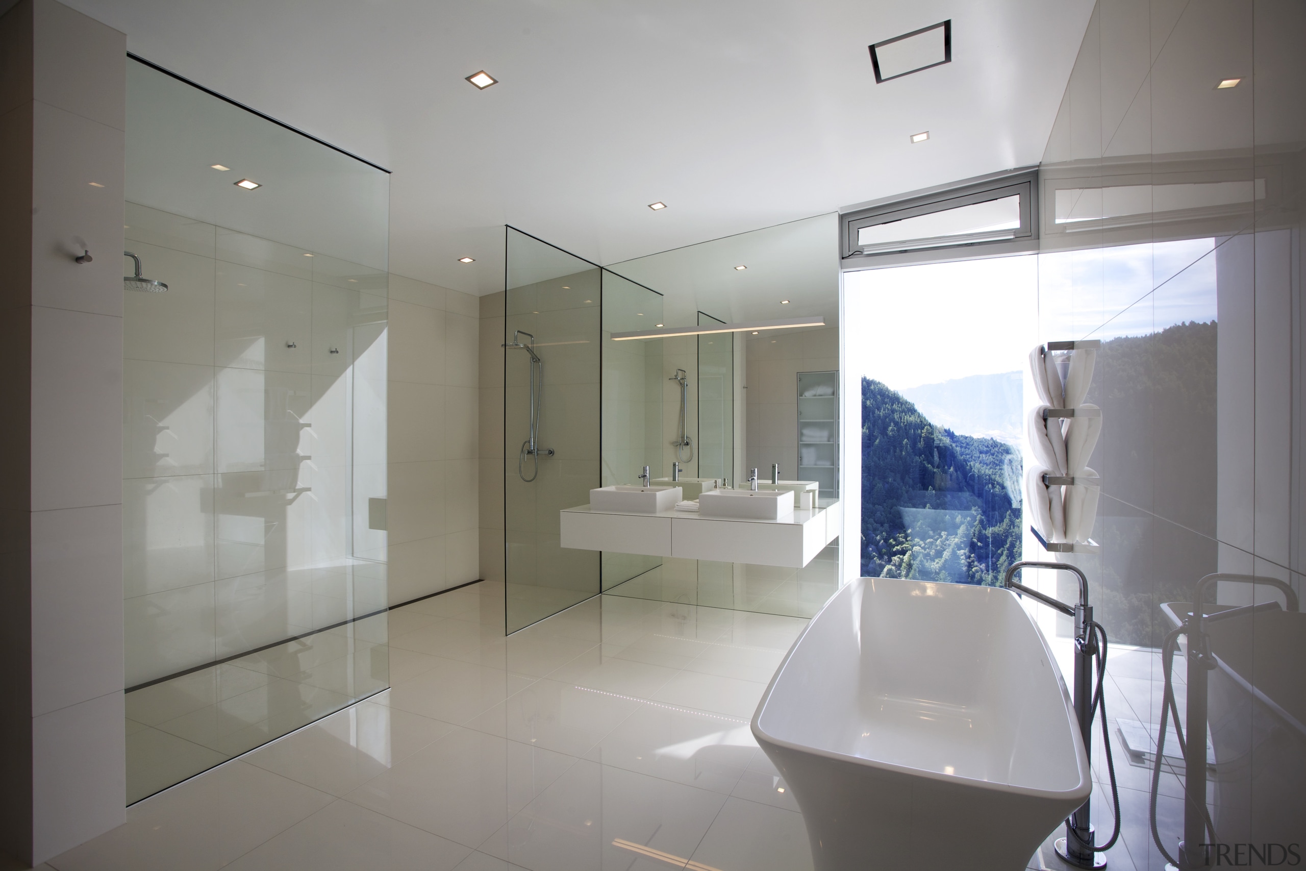 The freestanding tub in this master suite is architecture, bathroom, ceiling, estate, floor, glass, house, interior design, property, real estate, room, gray