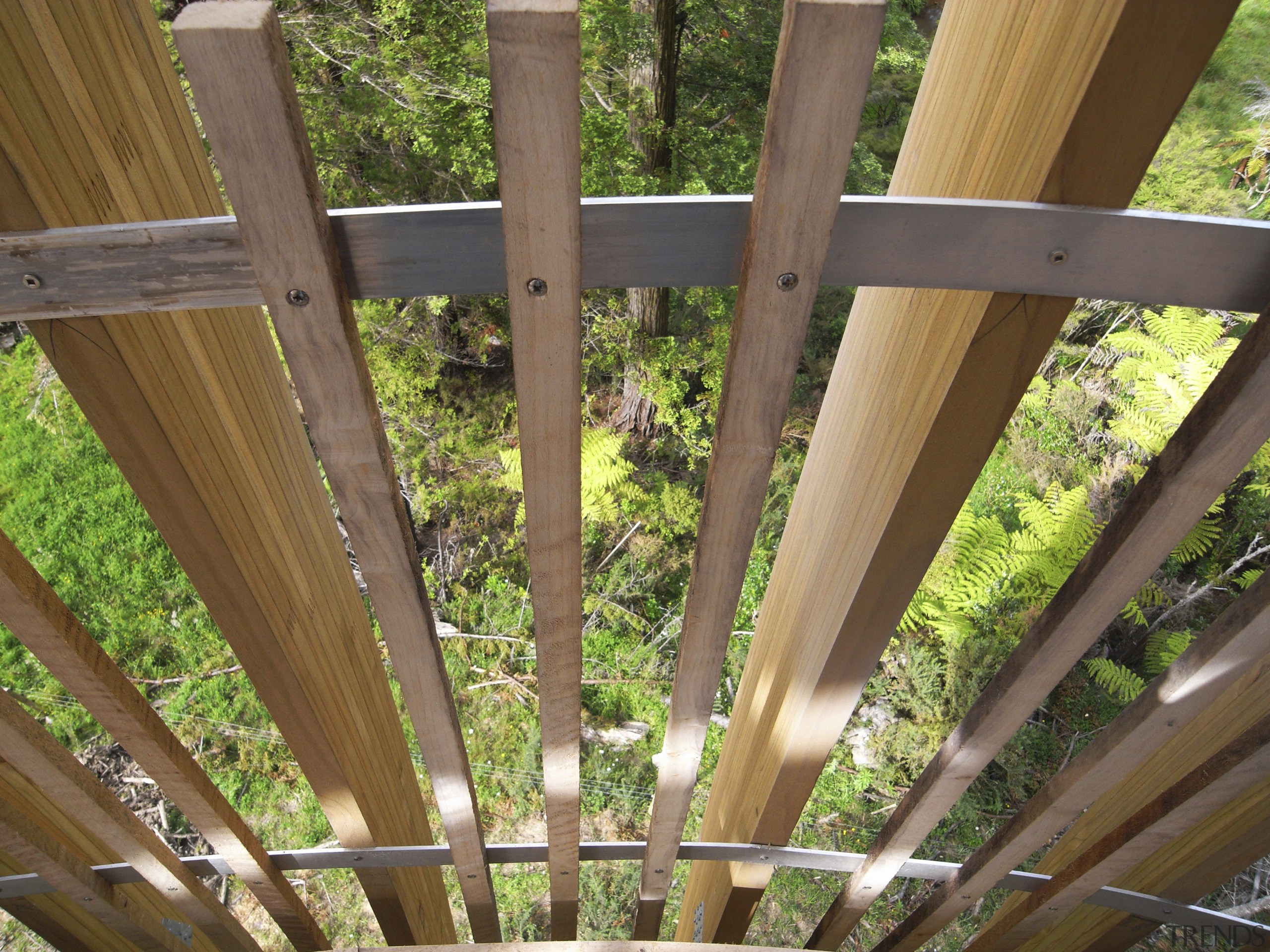 Image of the Yellow Treehouse restaurant which has architecture, beam, daylighting, facade, house, outdoor structure, roof, structure, tree, wood, brown