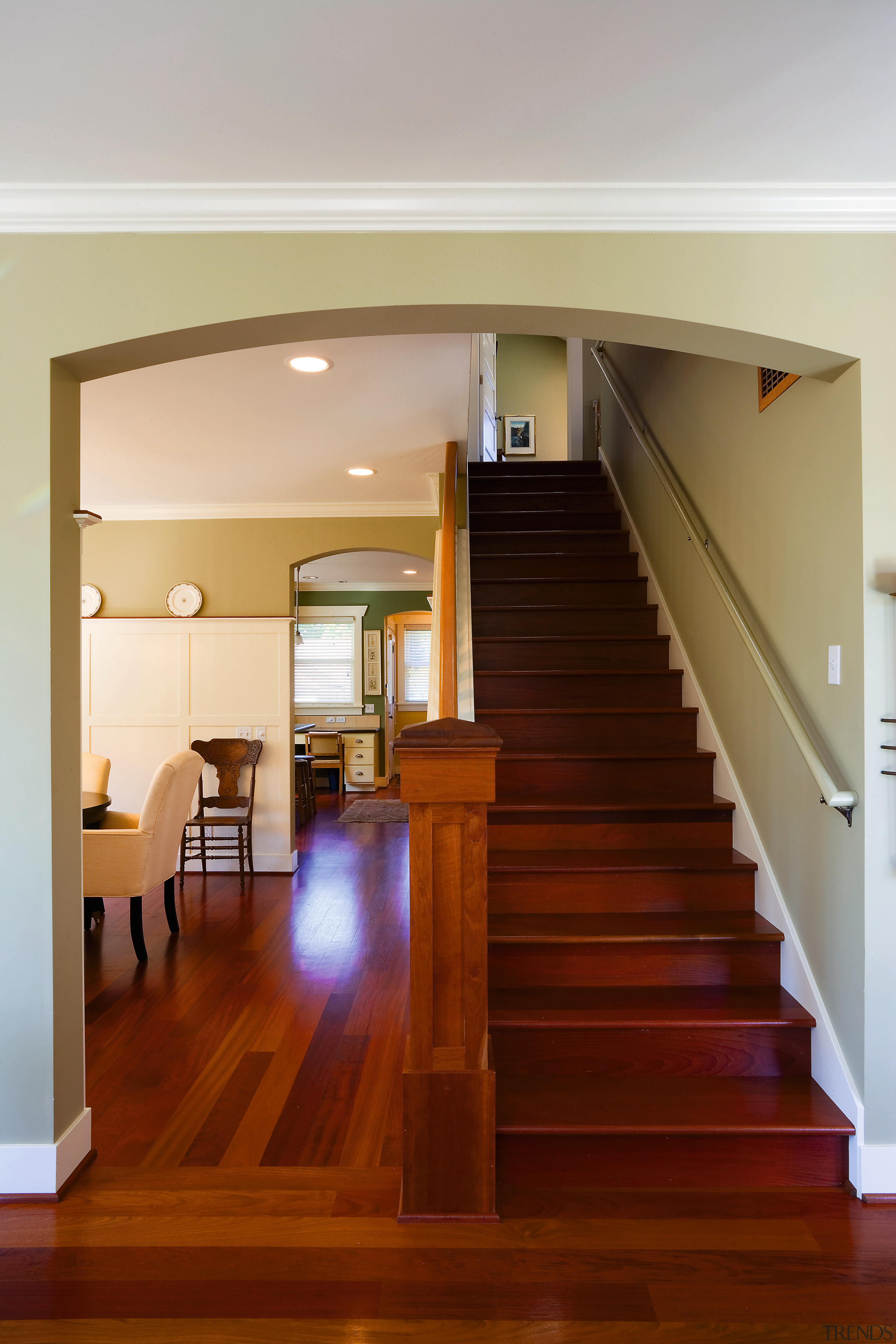 A view of the wooden staircase. - A architecture, ceiling, daylighting, floor, flooring, handrail, hardwood, home, house, interior design, laminate flooring, lighting, living room, real estate, stairs, wall, wood, wood flooring, gray, brown