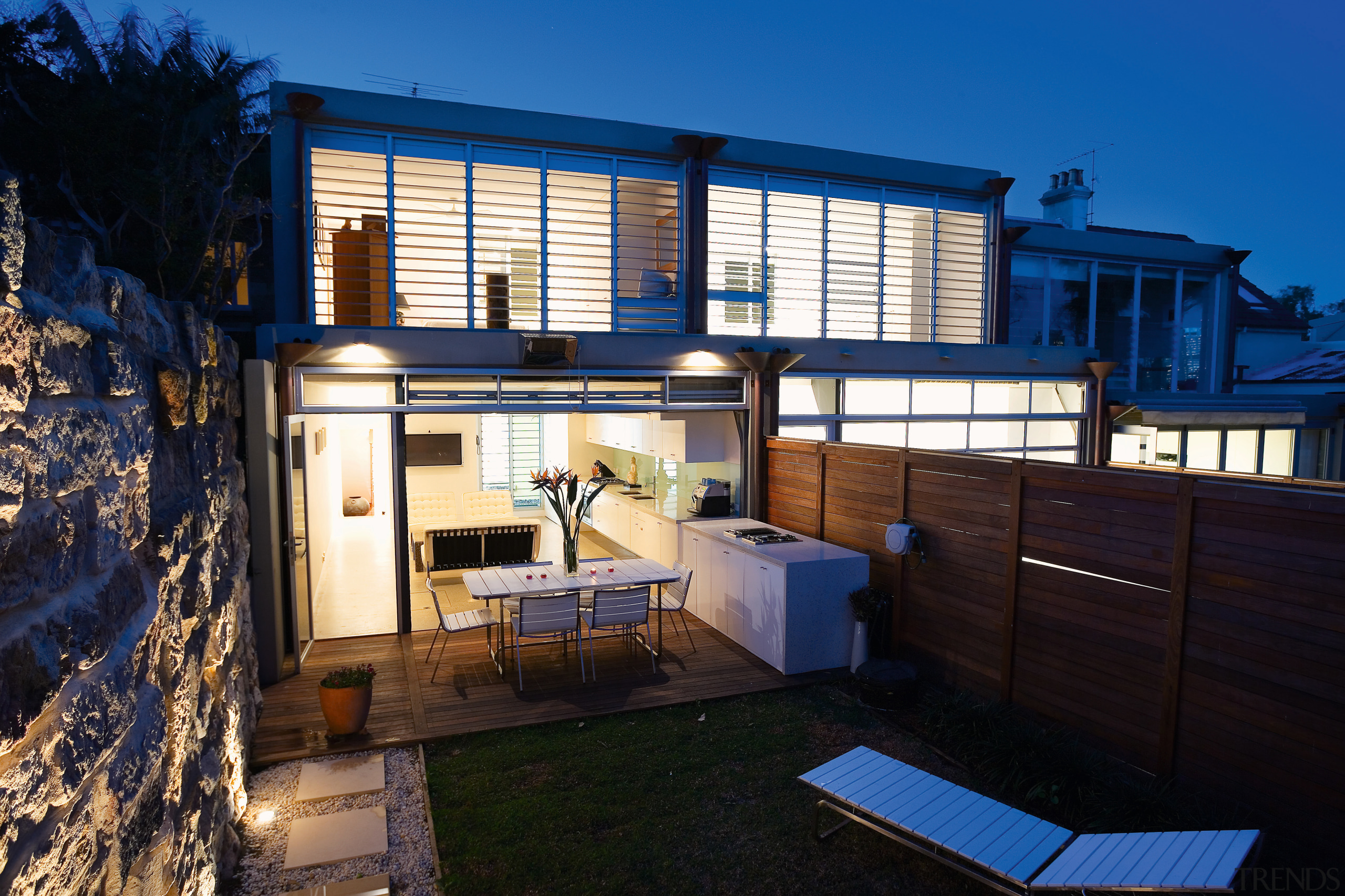 An exterior view of the patio area. - apartment, architecture, building, cottage, estate, facade, home, house, property, real estate, residential area, window, black, blue