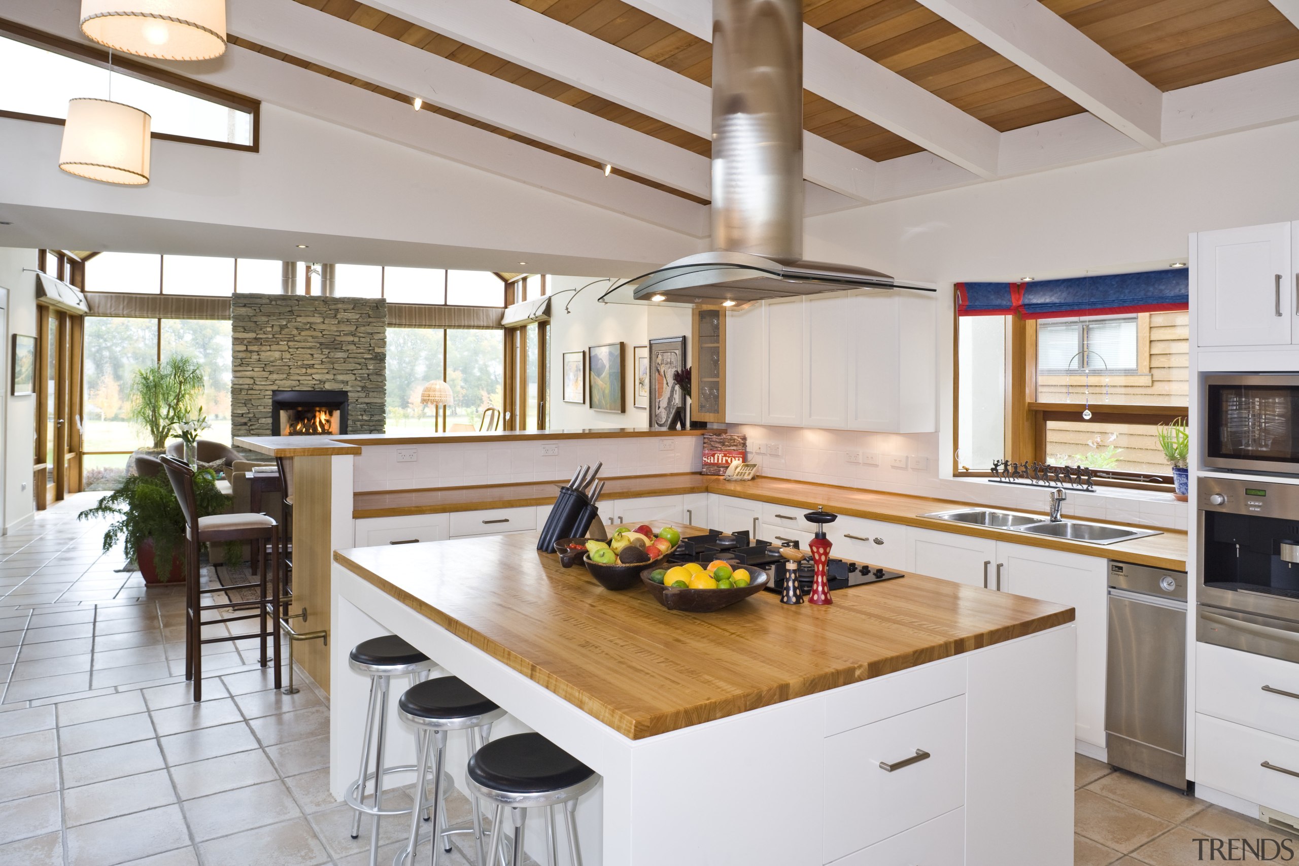 View of the kitchen which features an island countertop, cuisine classique, interior design, kitchen, real estate, gray, white