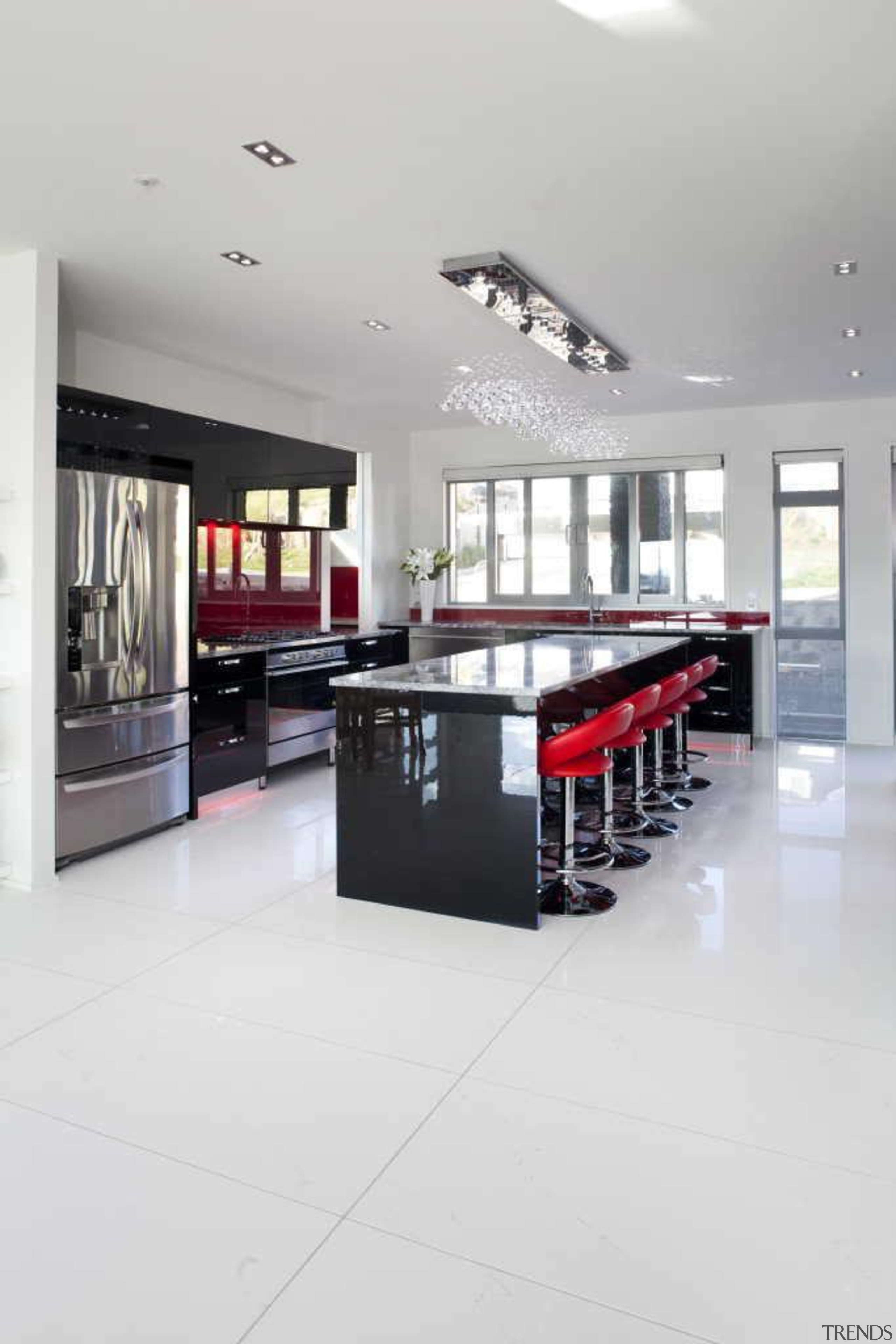 Spacious kitchen area with white feature contrasting with floor, flooring, interior design, kitchen, table, white, gray