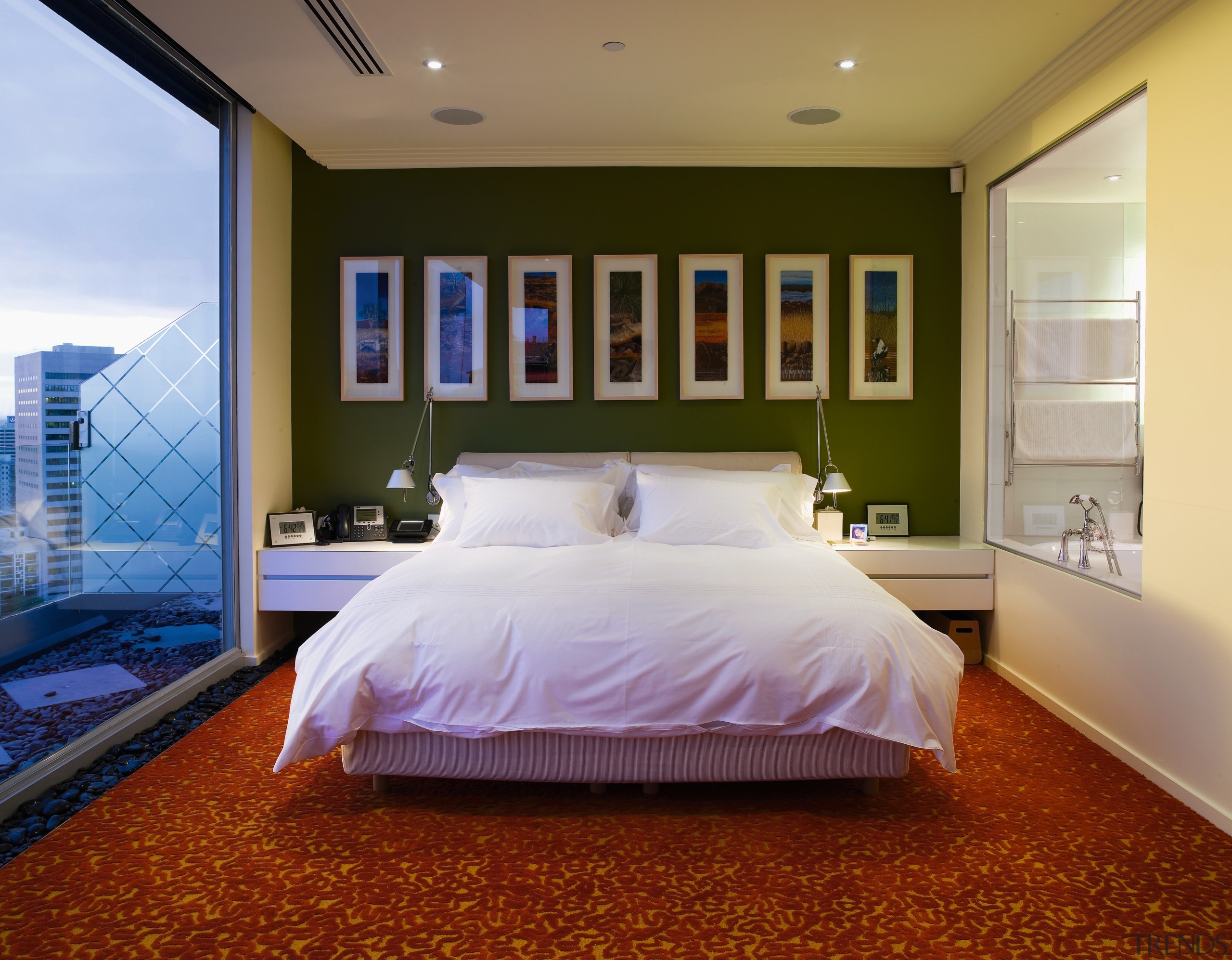 A view of the master bedroom featuring green bed, bed frame, bedroom, ceiling, daylighting, estate, floor, home, interior design, lighting, mattress, real estate, room, suite, wall, window, brown