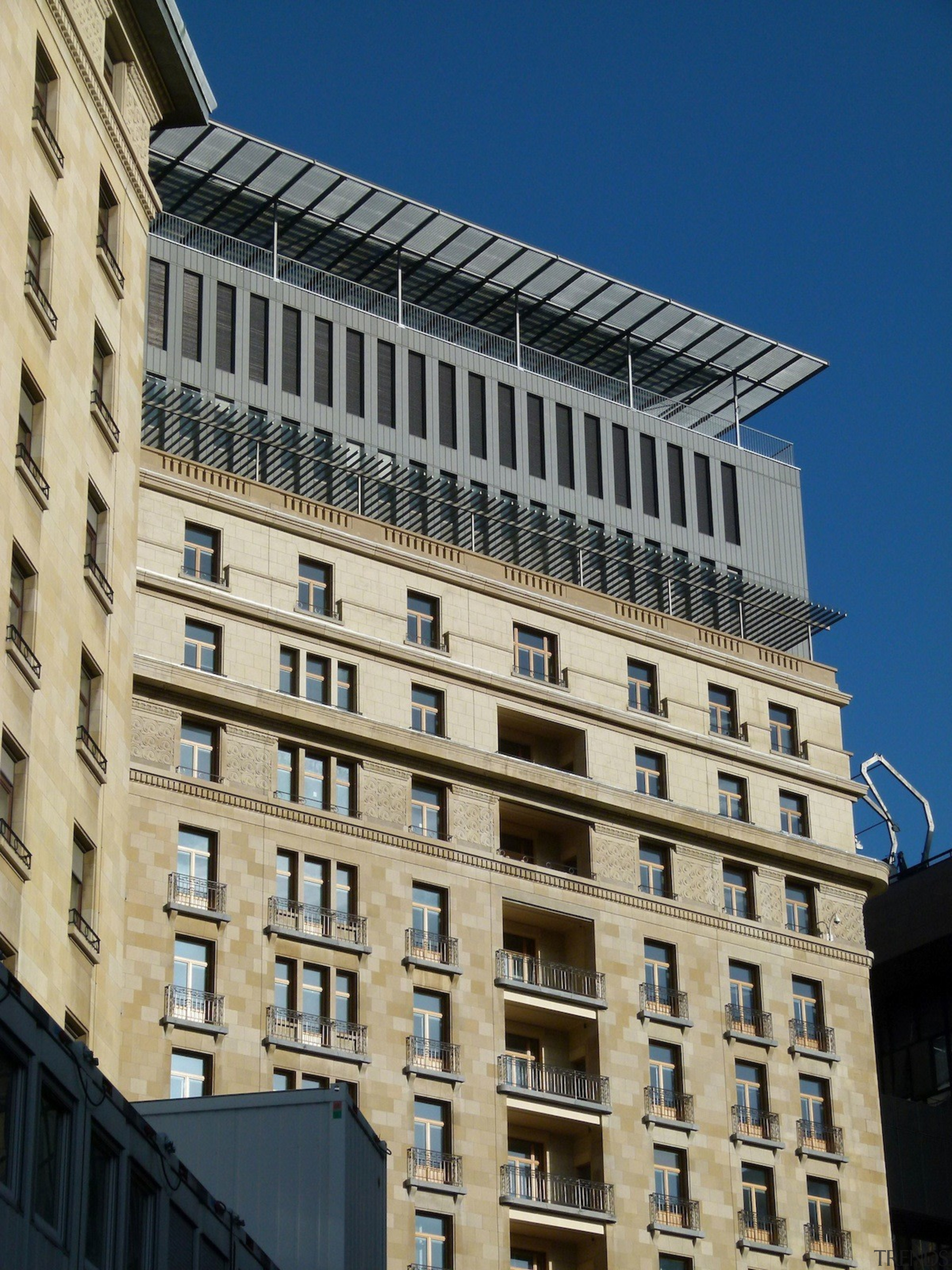 This new headquarters for the European Union Council apartment, architecture, building, city, commercial building, condominium, corporate headquarters, daytime, downtown, facade, headquarters, landmark, metropolis, metropolitan area, mixed use, neighbourhood, residential area, sky, skyscraper, tower block, urban area, window, orange