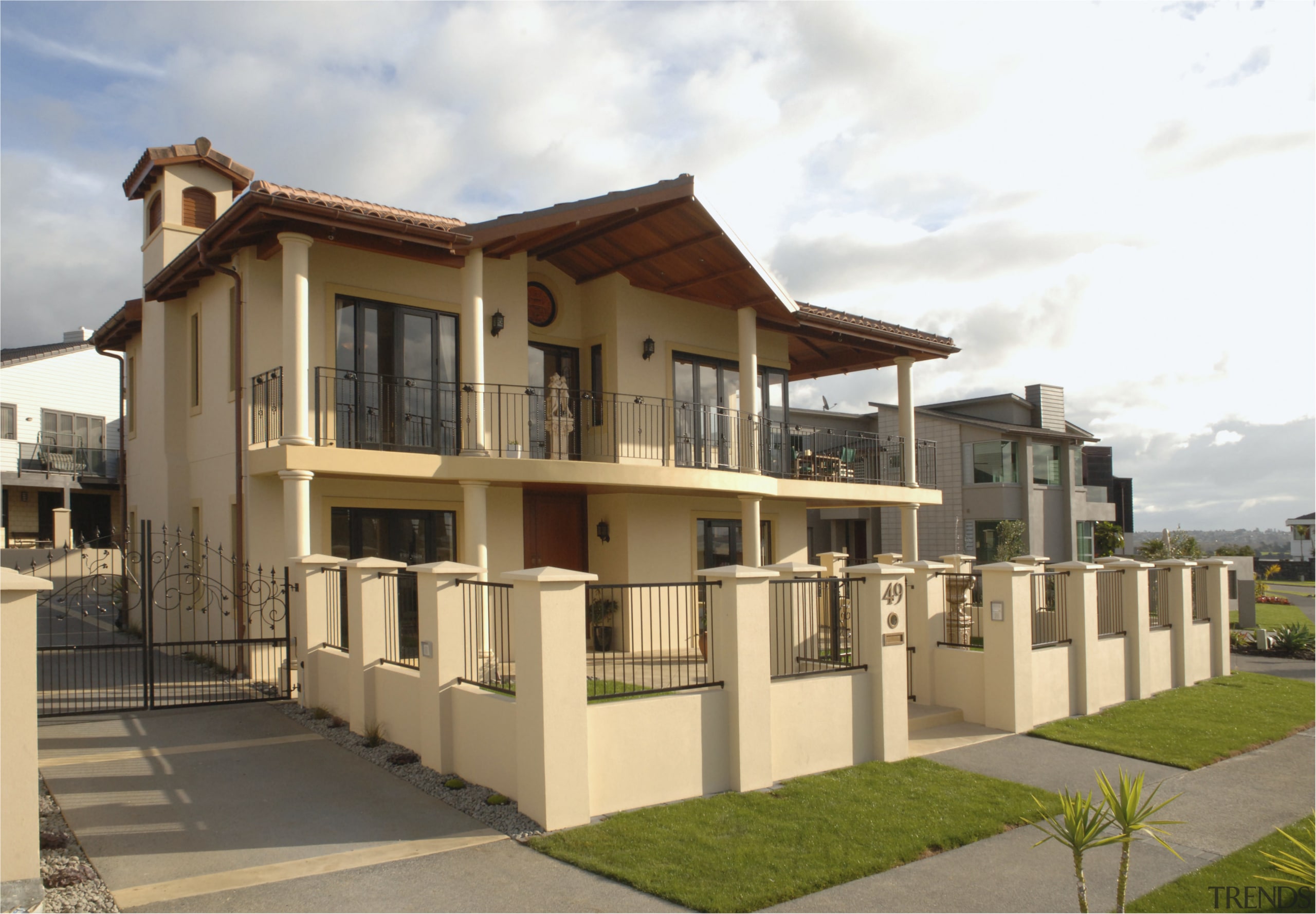 A view of a home designed by MF apartment, building, elevation, estate, facade, home, house, neighbourhood, official residence, property, real estate, residential area, villa, brown, white