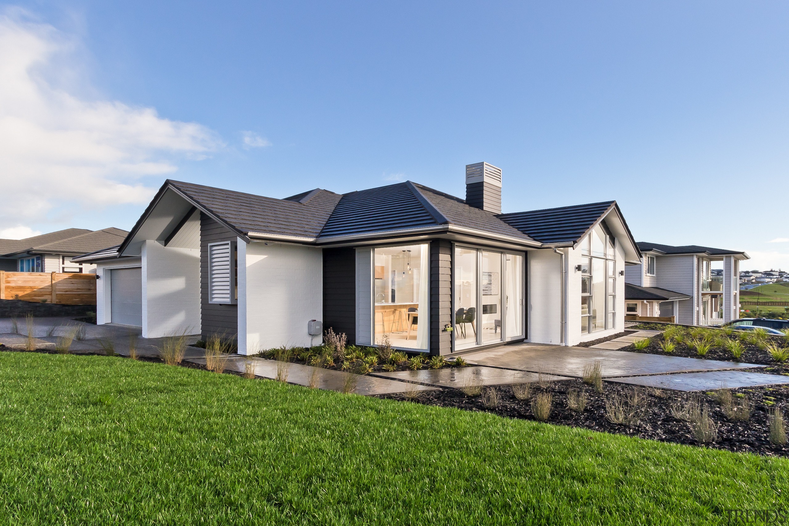 Living near the sea  this Millwater home, cottage, elevation, estate, facade, farmhouse, home, house, land lot, property, real estate, residential area, roof, villa, teal