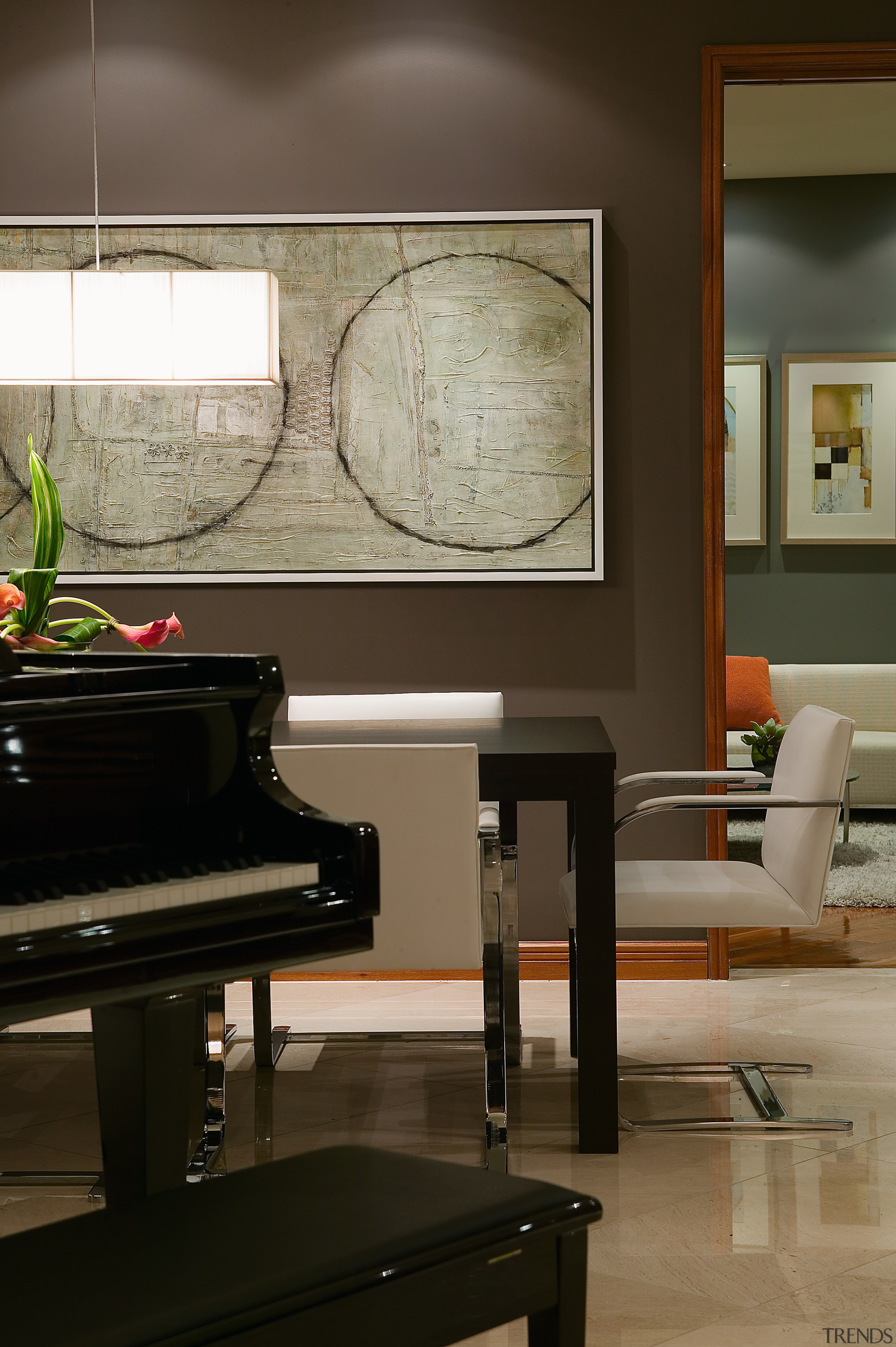 view of the living area featuring tiled flooring, floor, flooring, furniture, home, interior design, keyboard, living room, piano, table, technology, wall, wood, black, gray