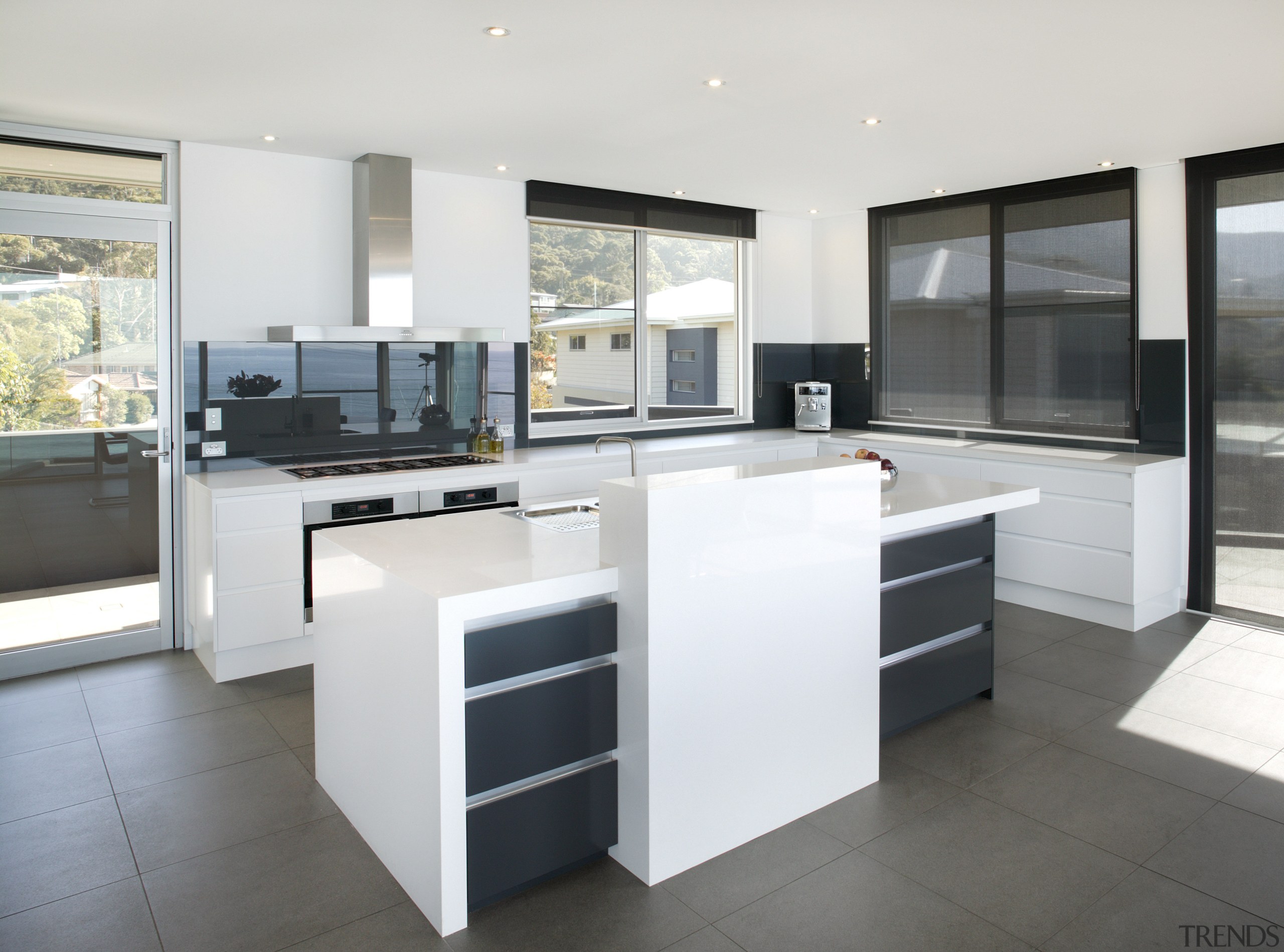 View of kitchen and dining area  designed cabinetry, countertop, cuisine classique, floor, flooring, interior design, kitchen, real estate, white, gray