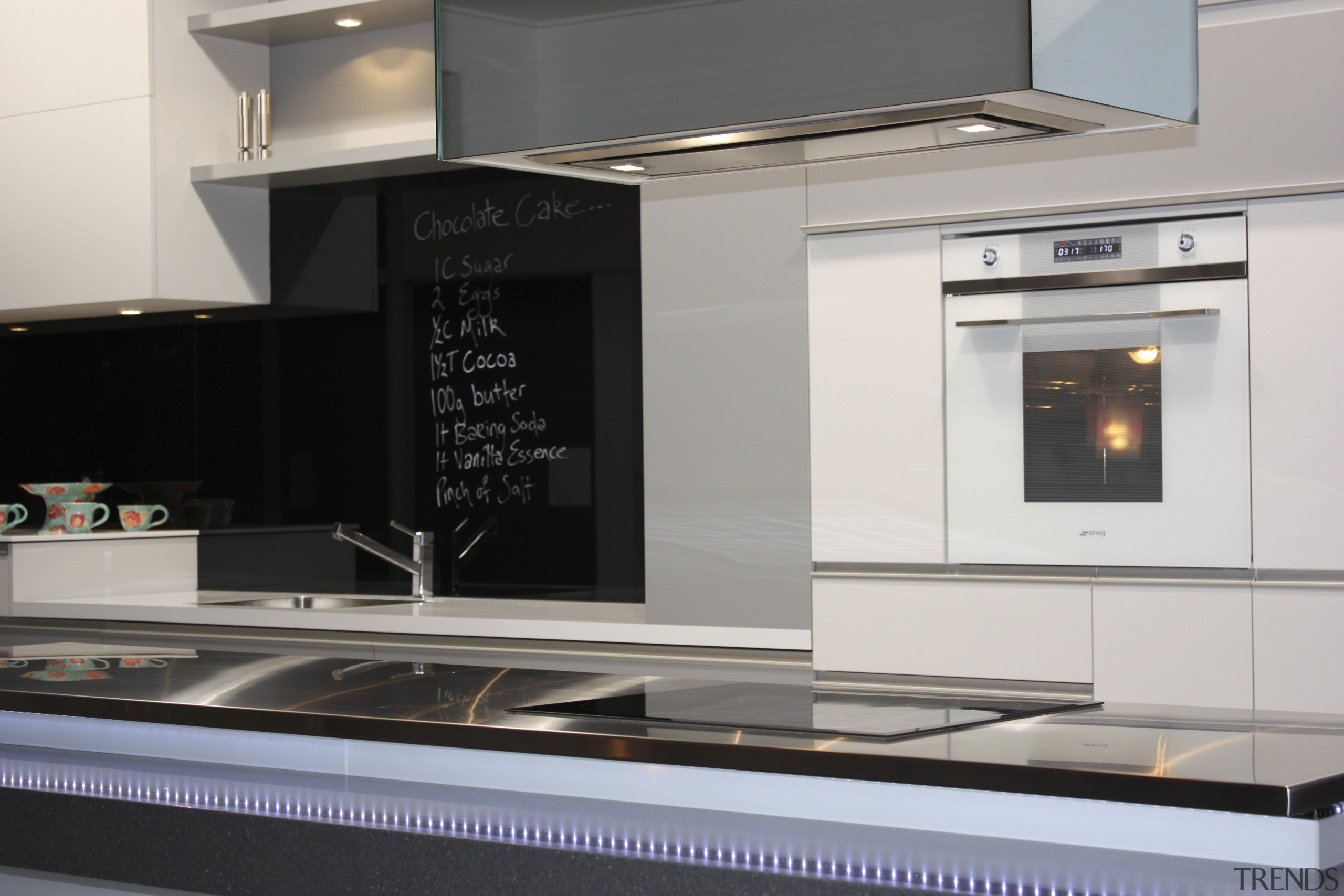 View of a contemporary kitchen area - View countertop, fireplace, home appliance, kitchen, kitchen appliance, kitchen stove, product design, gray, black