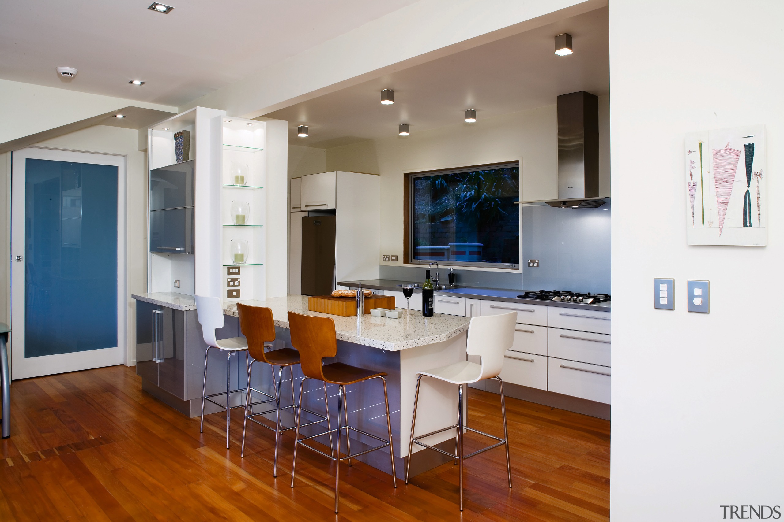 A view of the kitchen area, wooden flooring, floor, flooring, hardwood, interior design, kitchen, living room, property, real estate, room, wood flooring, white