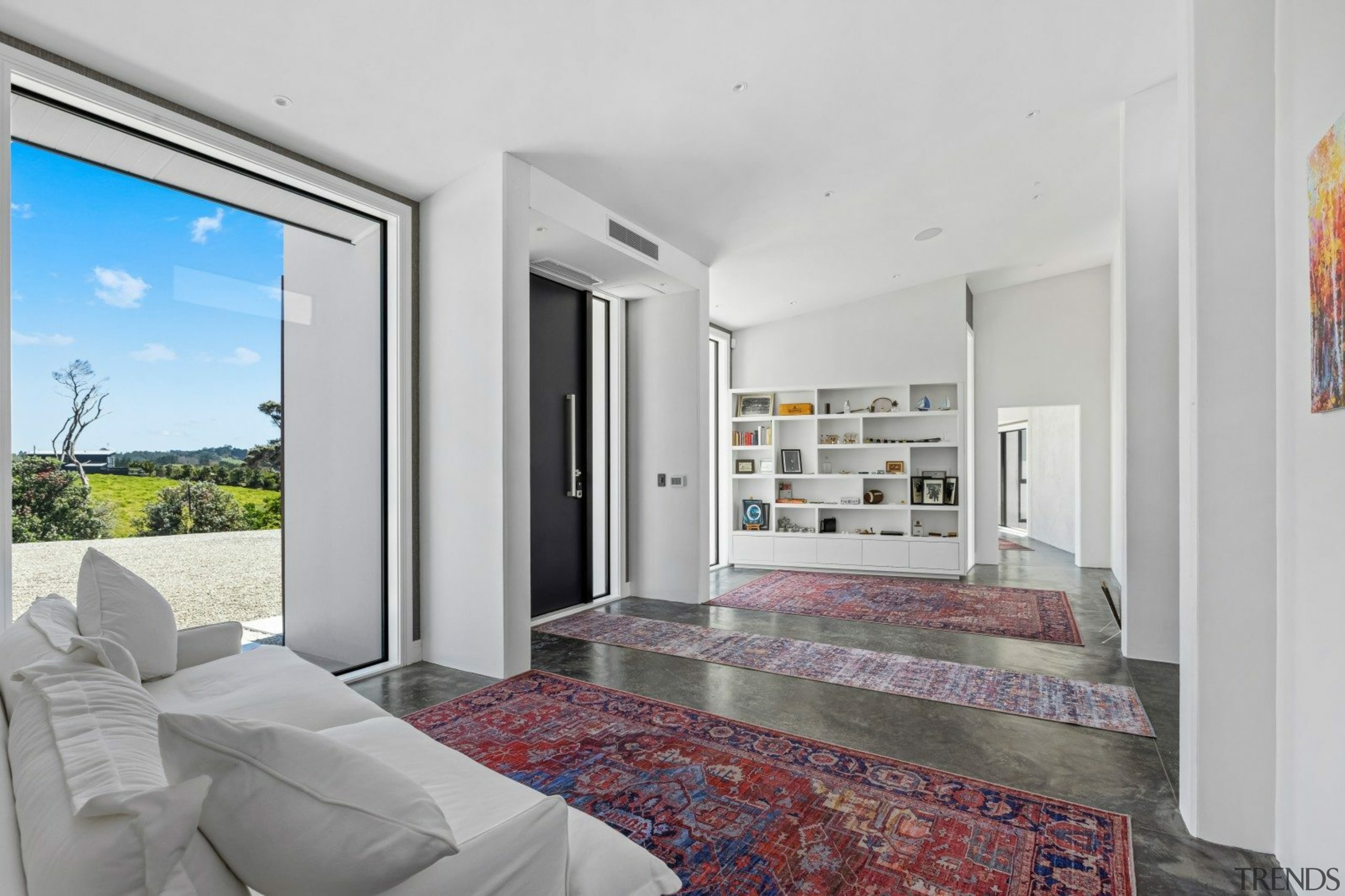 Expansive front foyer with open shelving. - Long 