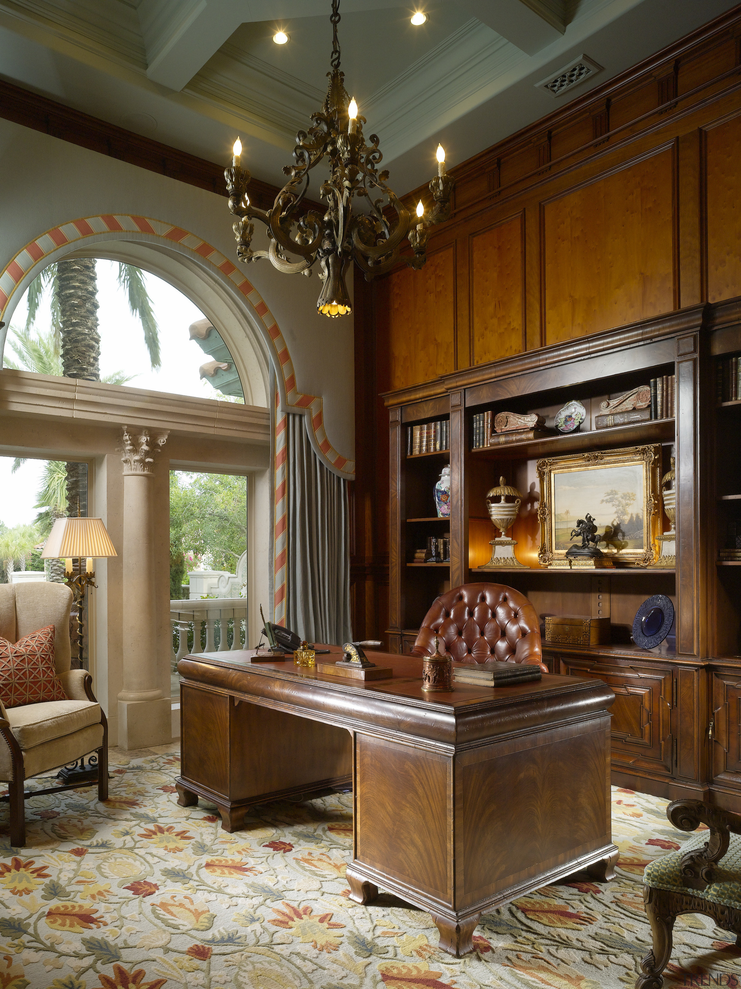 View of a study with chandelier, desk, shelving, ceiling, flooring, furniture, home, interior design, living room, lobby, table, brown