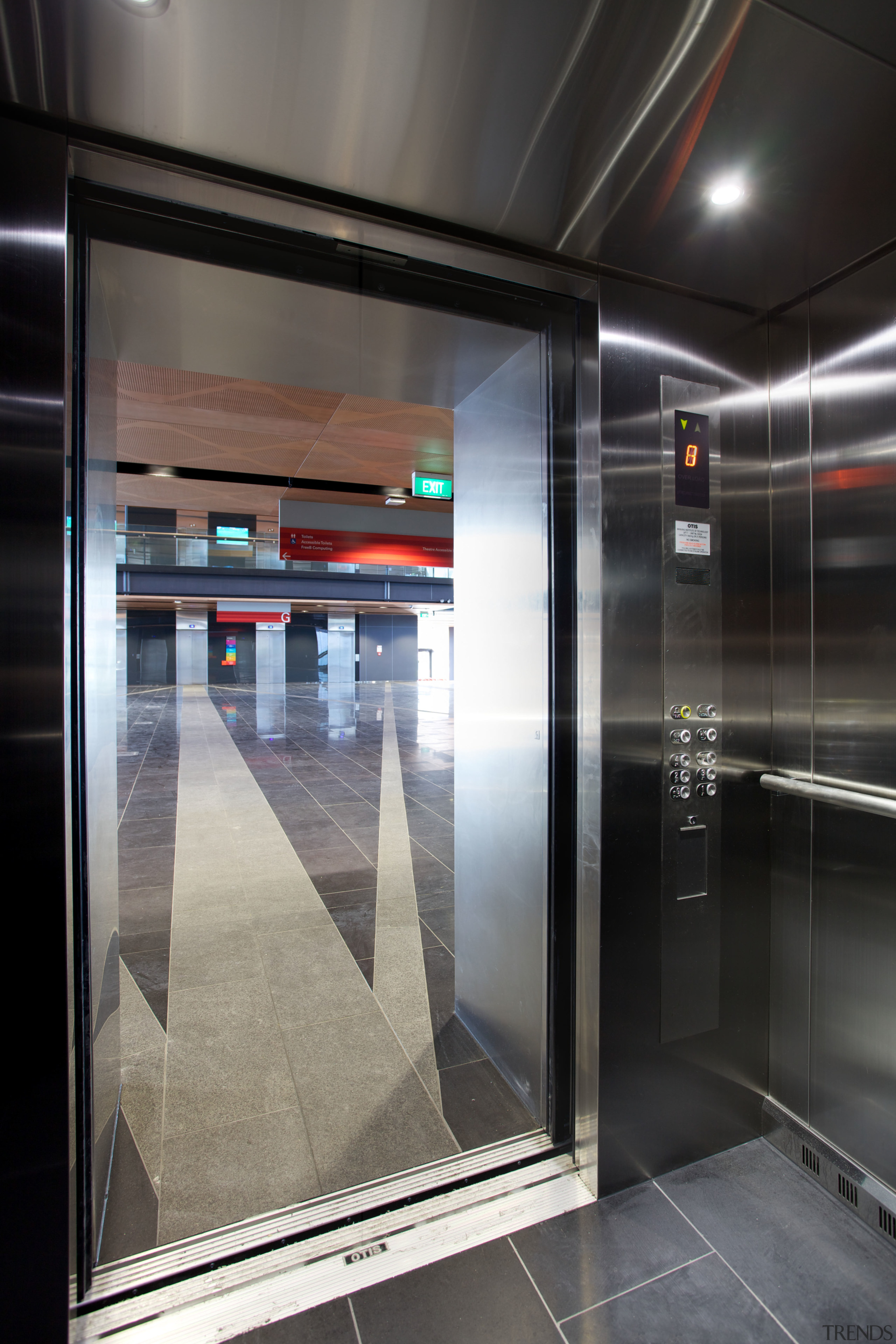 The Otis Gen2 Premier2 elevators on the MIT elevator, floor, glass, interior design, black, gray