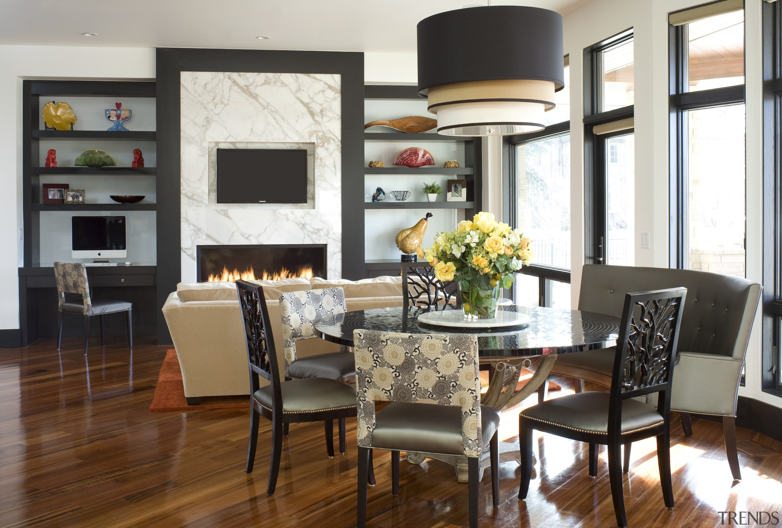 Black frames and polished wood floors provide a dining room, furniture, home, interior design, living room, room, table, white