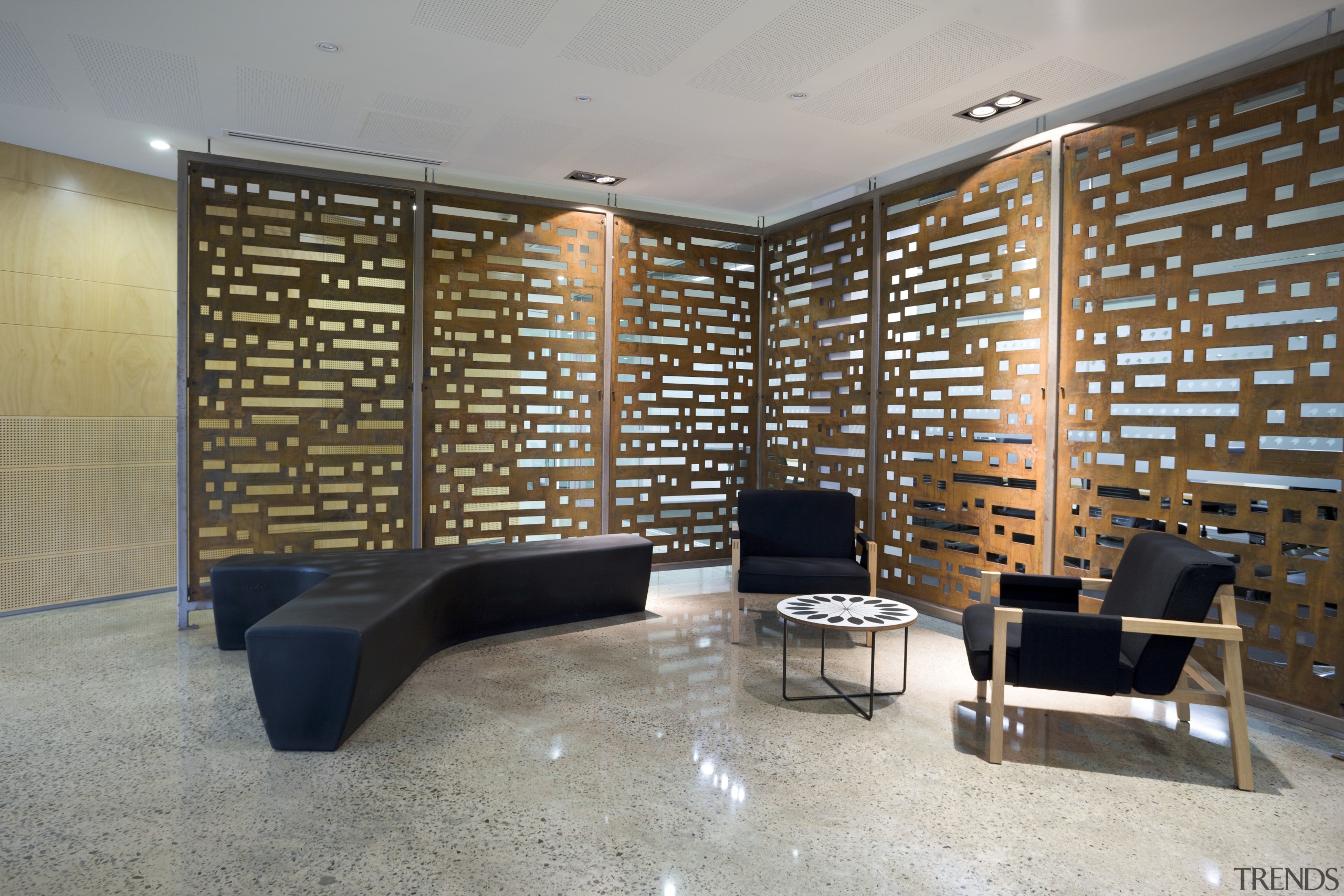 View of seating area with feature walls walls. architecture, floor, flooring, interior design, lobby, real estate, wall, gray, brown