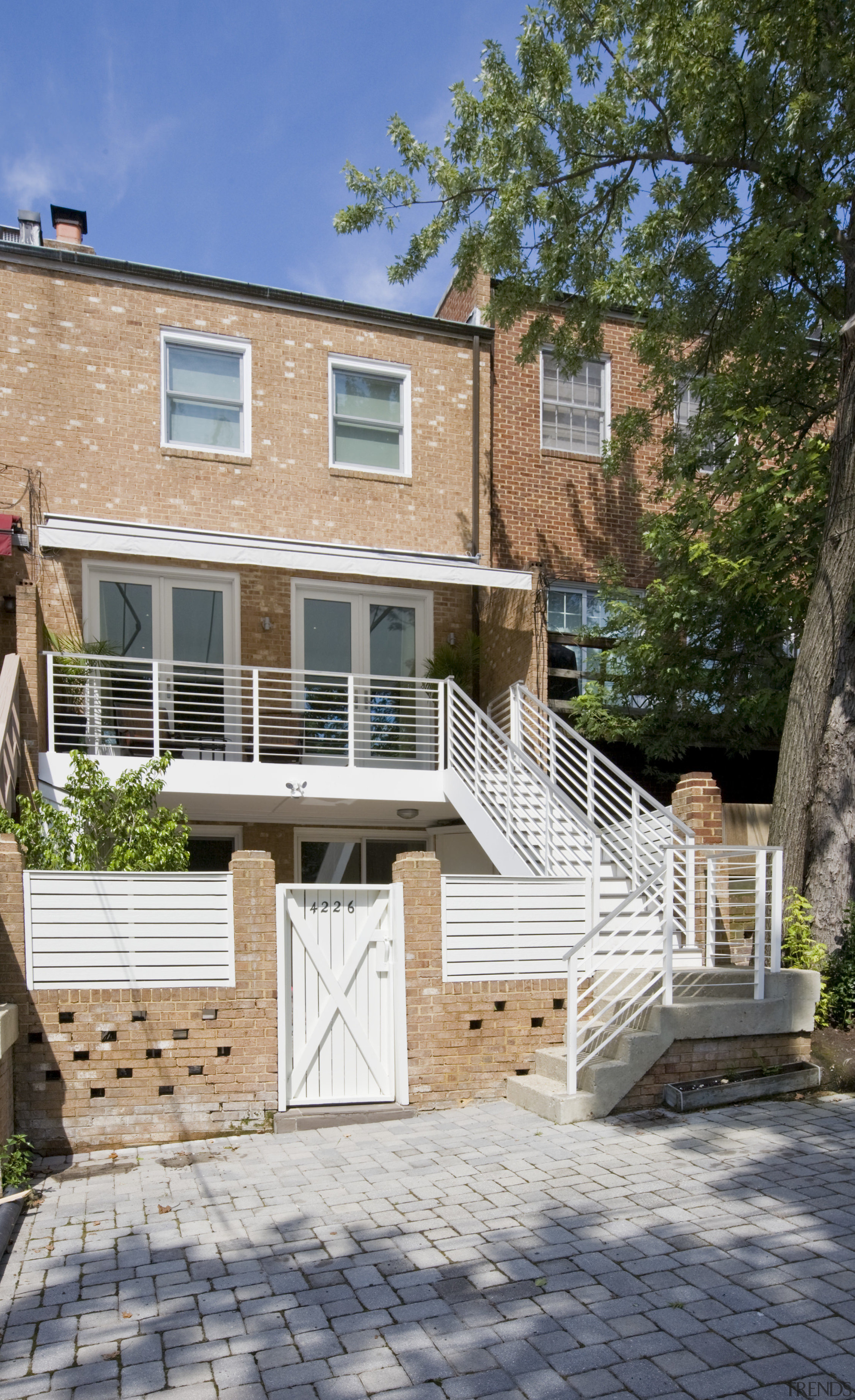 Rear view of contemporary townhouse renovation - Rear backyard, cottage, deck, estate, facade, home, house, outdoor structure, porch, property, real estate, residential area, siding, walkway, window