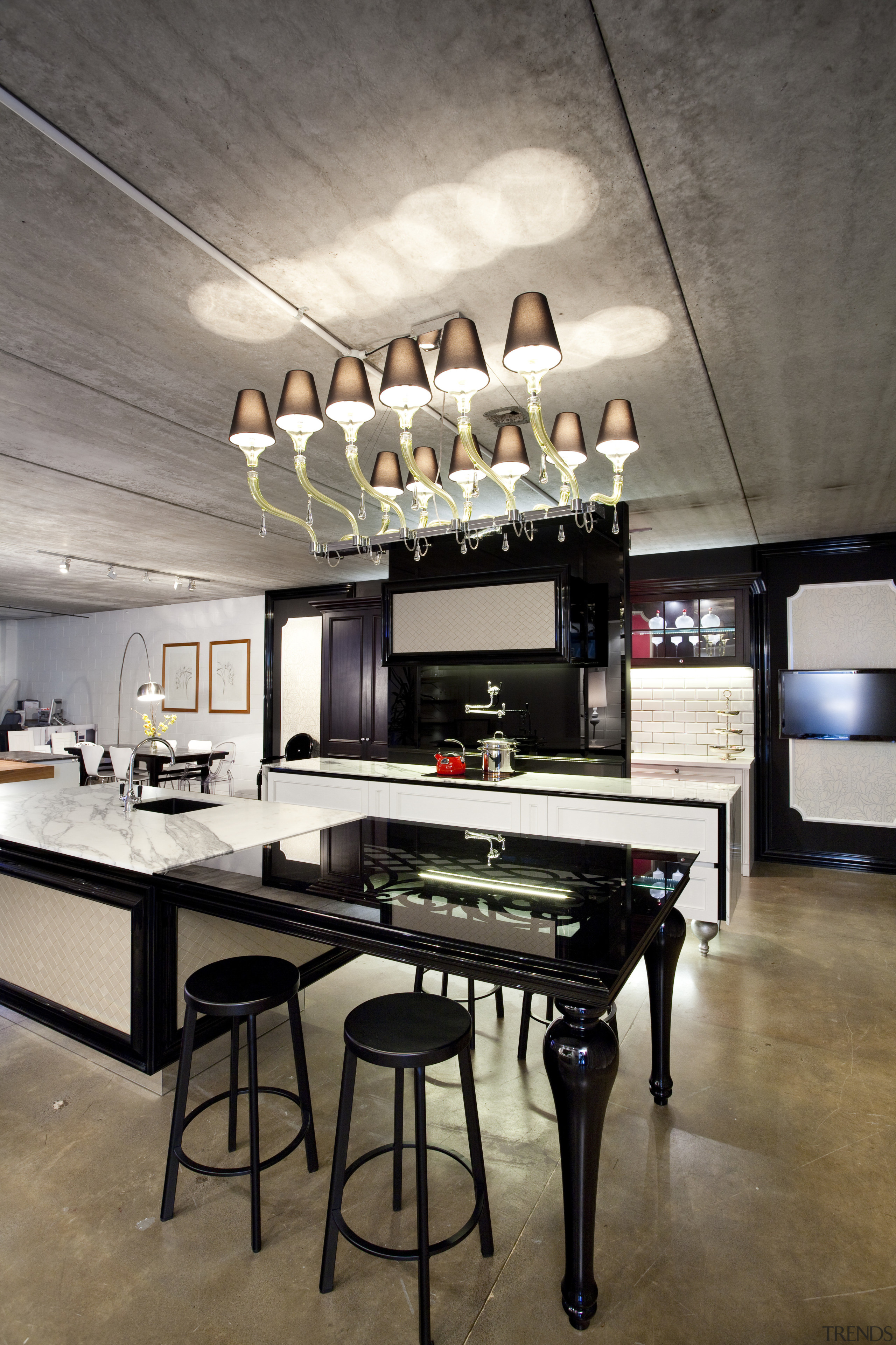 View of contemporary kitchen with lighting feature, black ceiling, interior design, table, gray