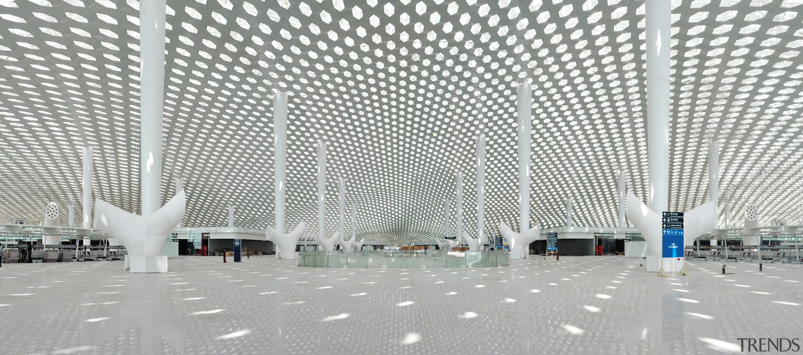 Looking much like a giant sculpture from both airport terminal, architecture, building, convention center, daylighting, infrastructure, line, metropolitan area, structure, white, gray