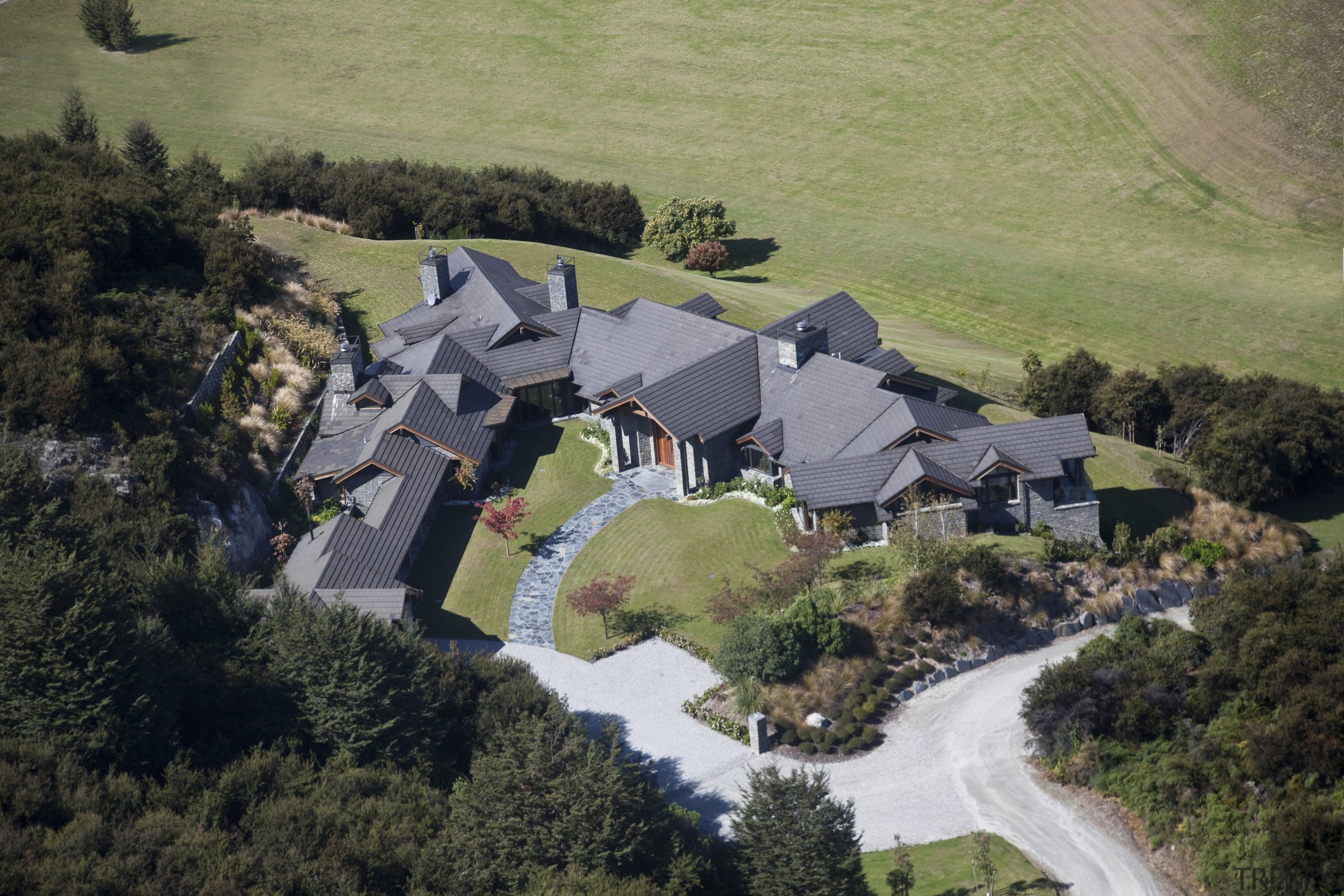 High angle shot of contemporary hilltop home. - aerial photography, bird's eye view, cottage, estate, home, house, landscape, photography, property, real estate, rural area, suburb, village, black