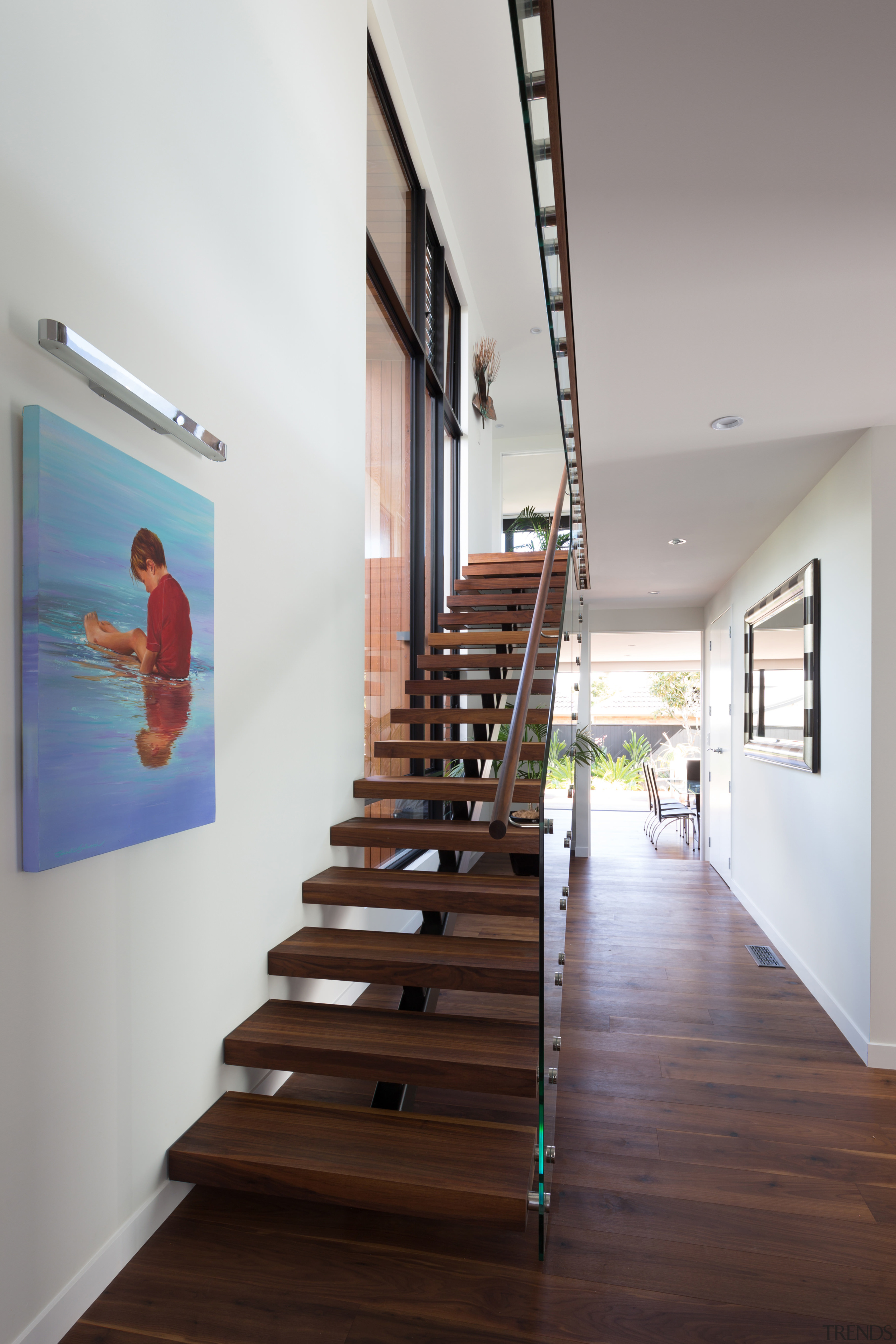 This homes feature walnut, floating staircase is also architecture, daylighting, floor, handrail, house, interior design, product design, stairs, gray