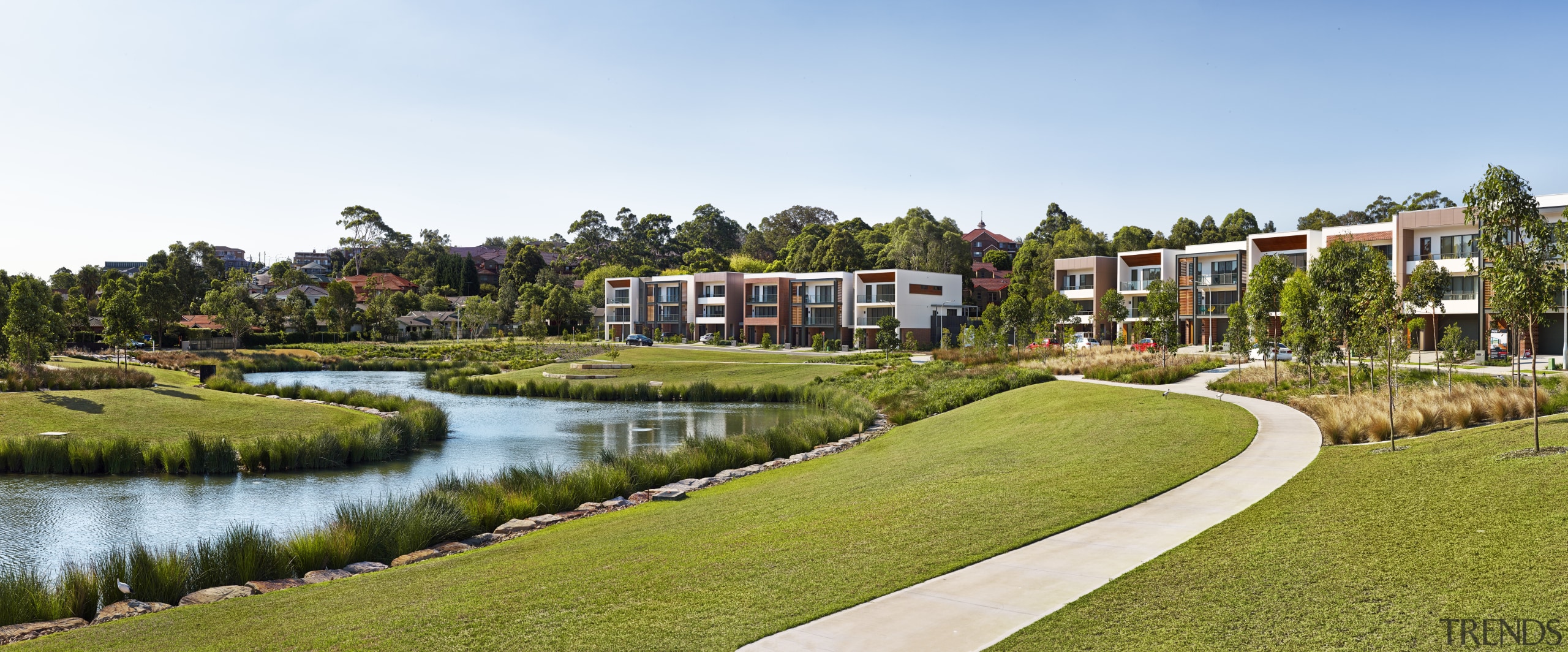 :Dress circle  a semi-circle of three-level freestanding city, estate, grass, home, house, landscape, leisure, neighbourhood, property, real estate, residential area, resort, sky, suburb, tree, water, white, brown