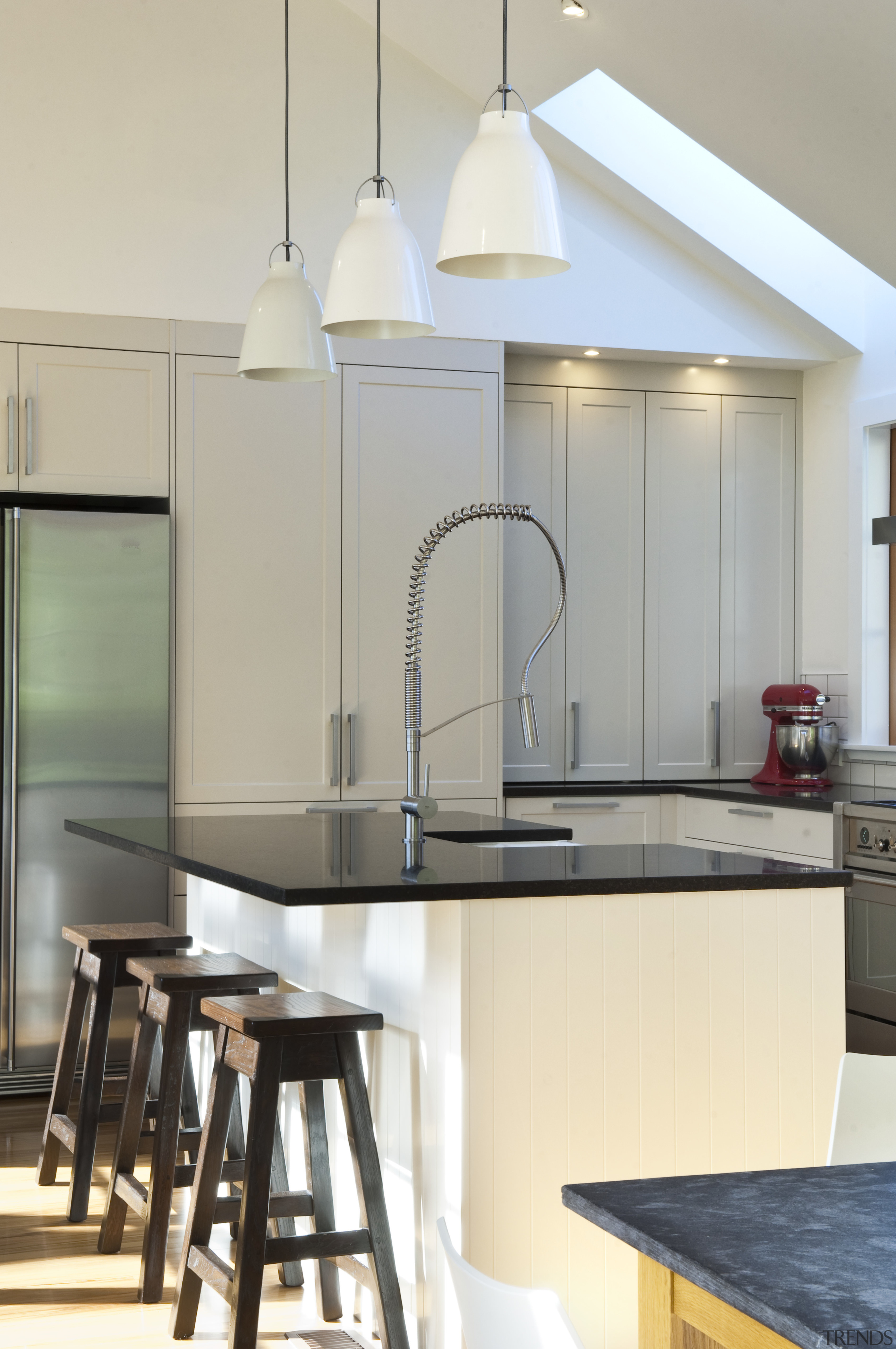 View of renovated kitchen which features timber floors, countertop, home, interior design, kitchen, light fixture, product design, table, gray