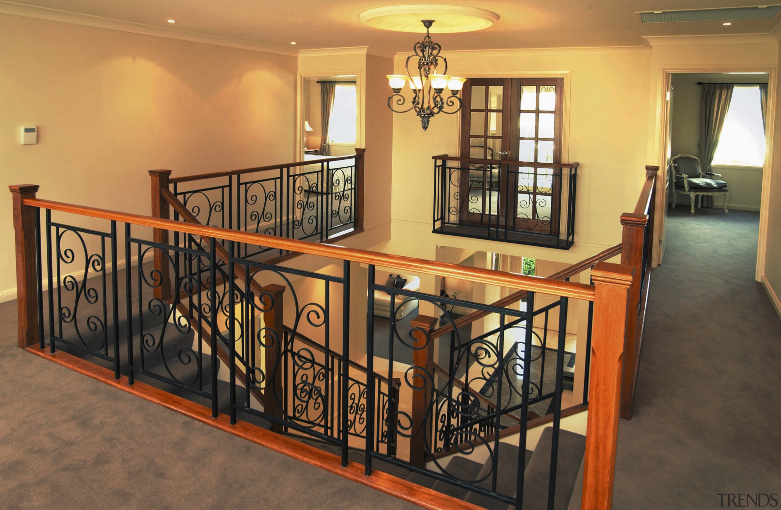 Stairway and landing with ornate iron balustrades, timber baluster, estate, floor, flooring, handrail, home, iron, property, real estate, stairs, orange, brown