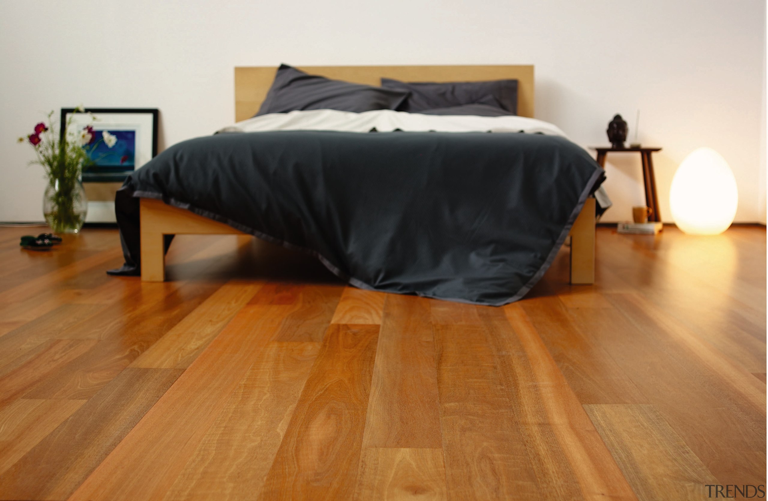 A view of these living areas featuring polished bed, bed frame, bedroom, floor, flooring, furniture, hardwood, laminate flooring, mattress, property, room, wood, wood flooring, brown, white