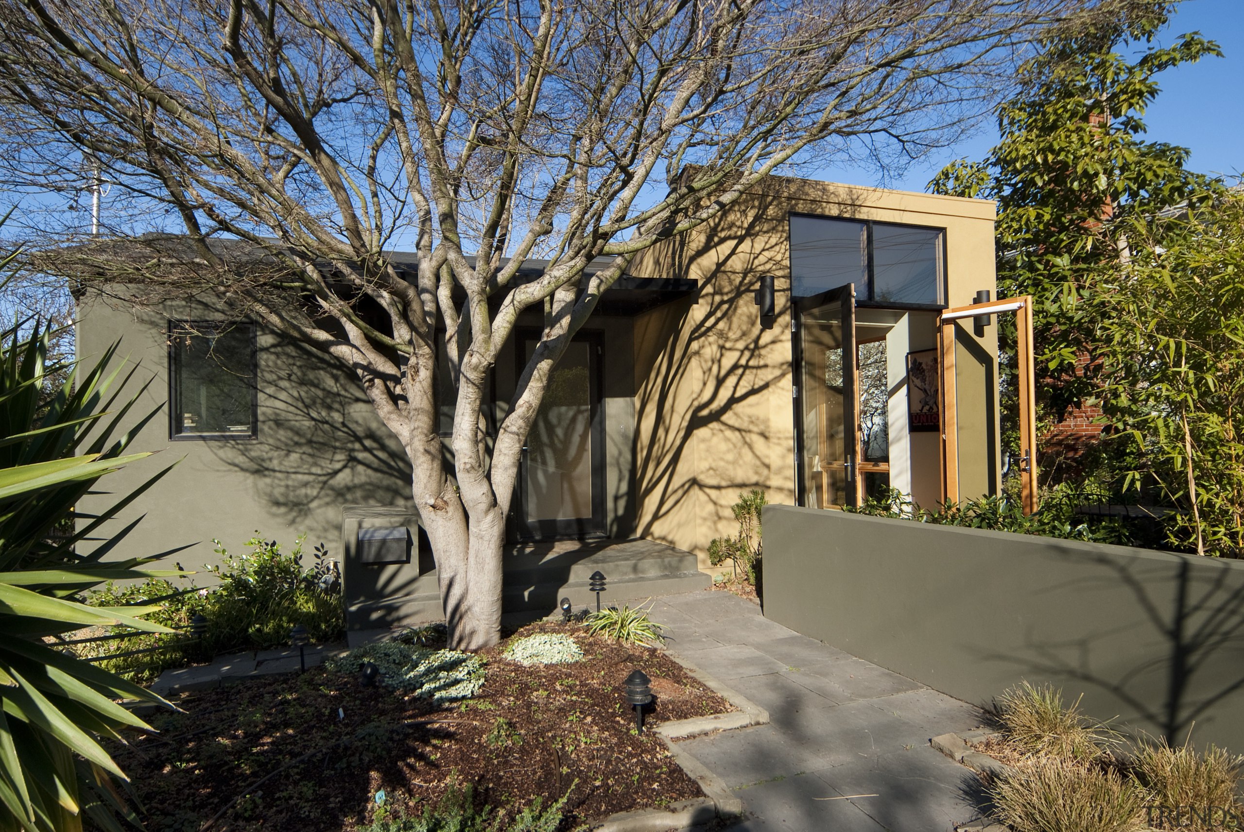 Entrance leading up to home with landscaping. - architecture, estate, facade, home, house, landscape, plant, property, real estate, residential area, tree, brown, black