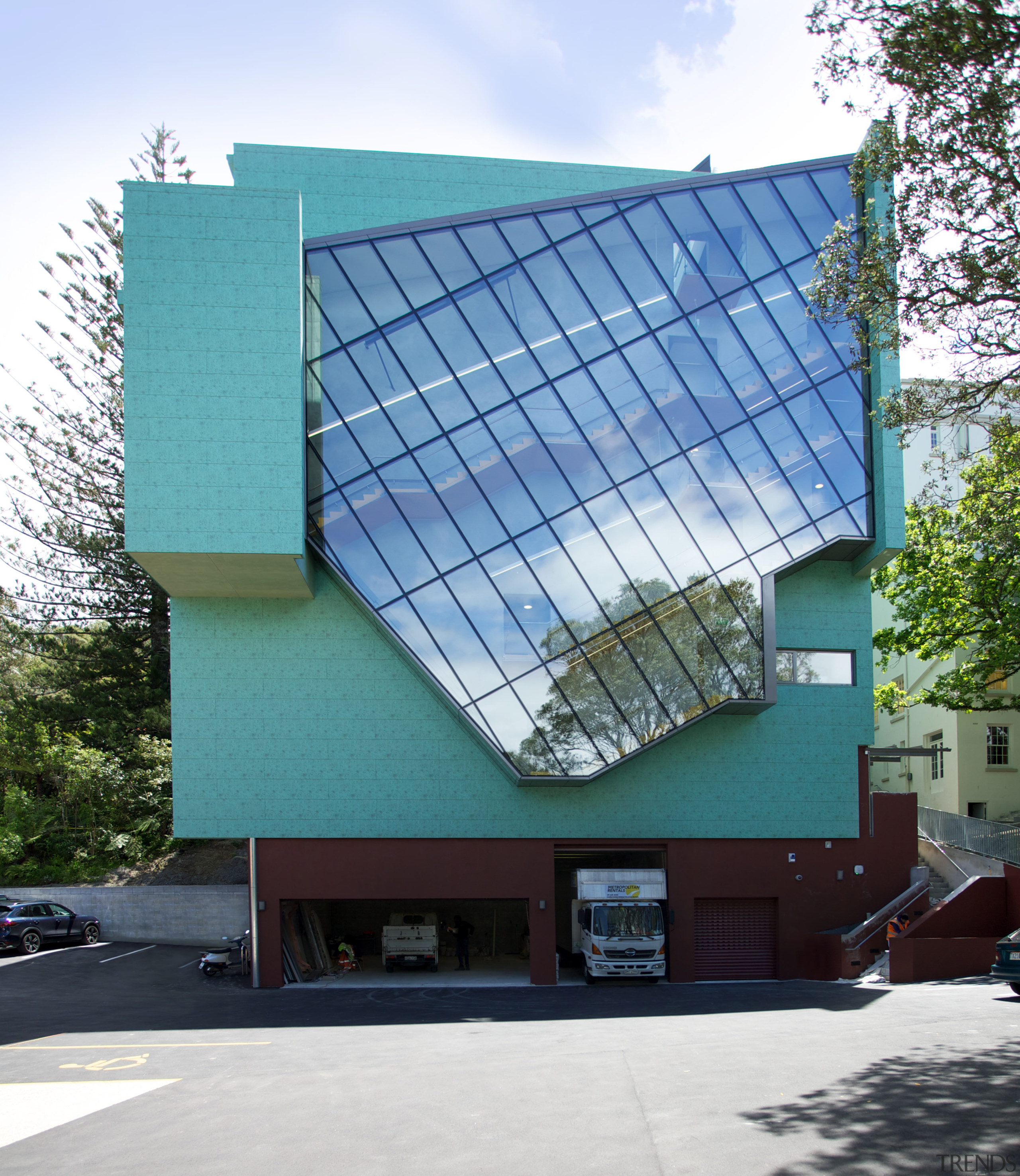 A glazed curtainwall on the southern elevation of architecture, building, commercial building, corporate headquarters, daylighting, daytime, facade, headquarters, house, metropolitan area, residential area, roof, structure, window, white, teal