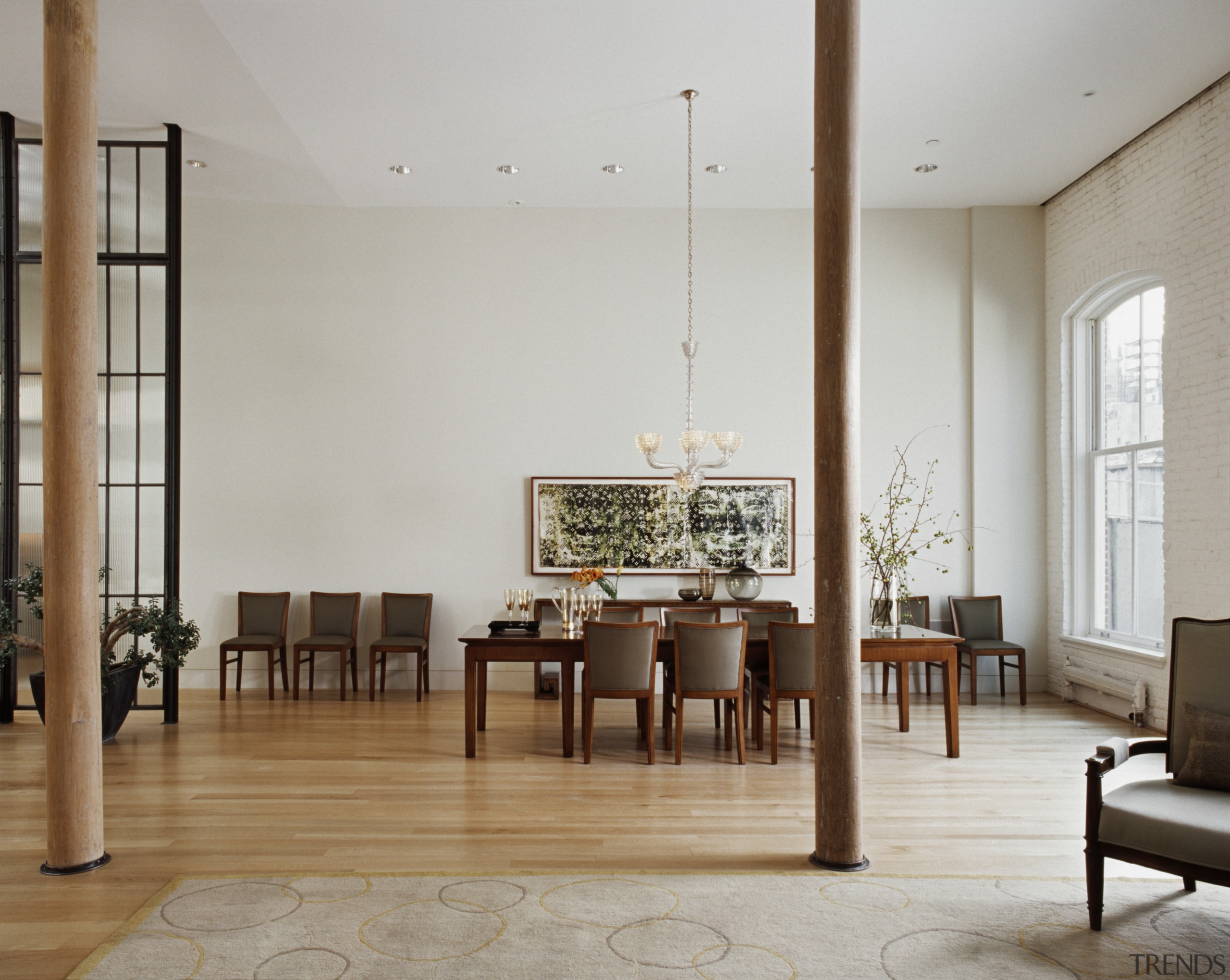 This once-derelict loft has been converted into a chair, dining room, floor, flooring, furniture, interior design, living room, room, table, gray