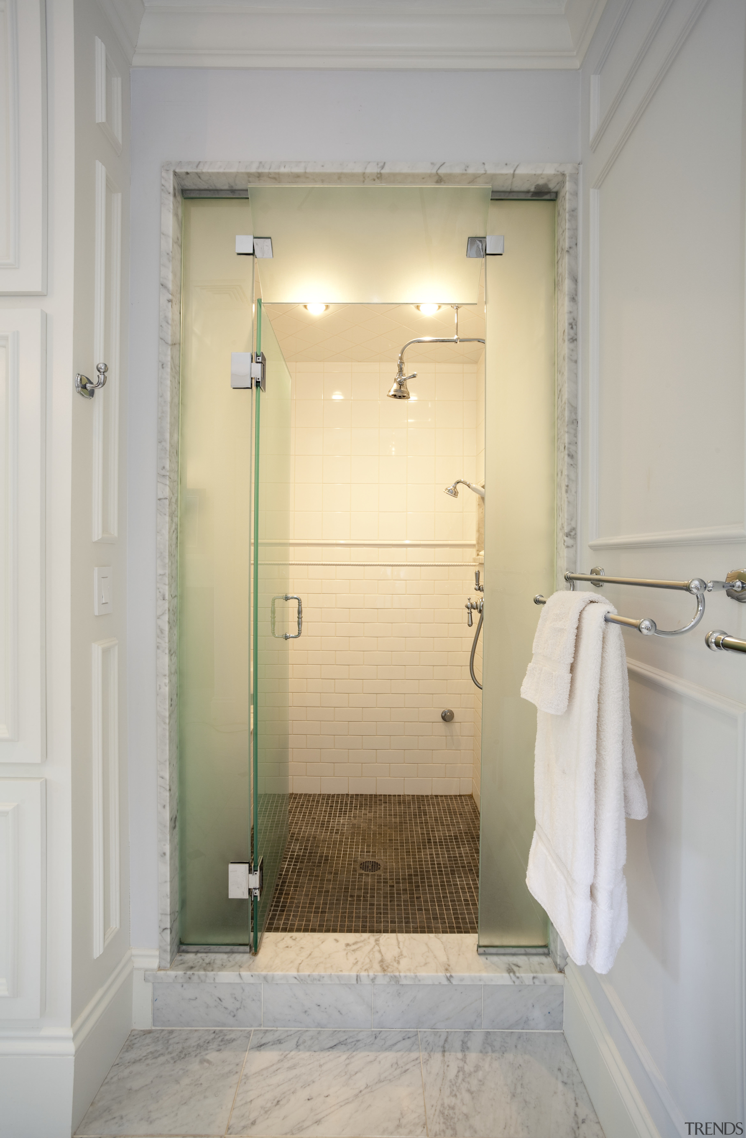 The shower room is completely enclosed so it bathroom, door, floor, home, interior design, plumbing fixture, room, tile, gray