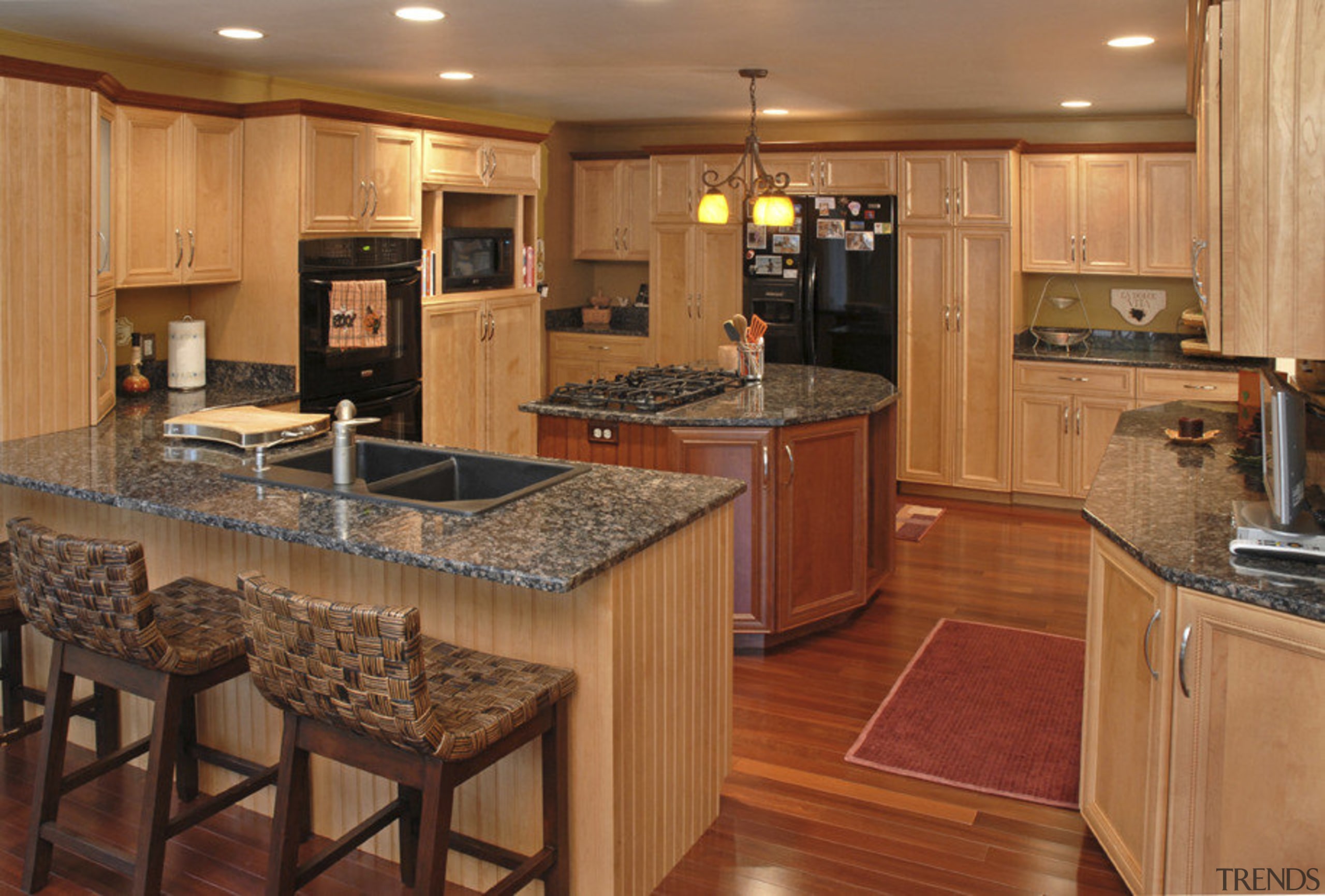 View of kithen with woden flooring, red floor cabinetry, countertop, cuisine classique, floor, flooring, hardwood, interior design, kitchen, room, wood, wood flooring, orange, brown, red