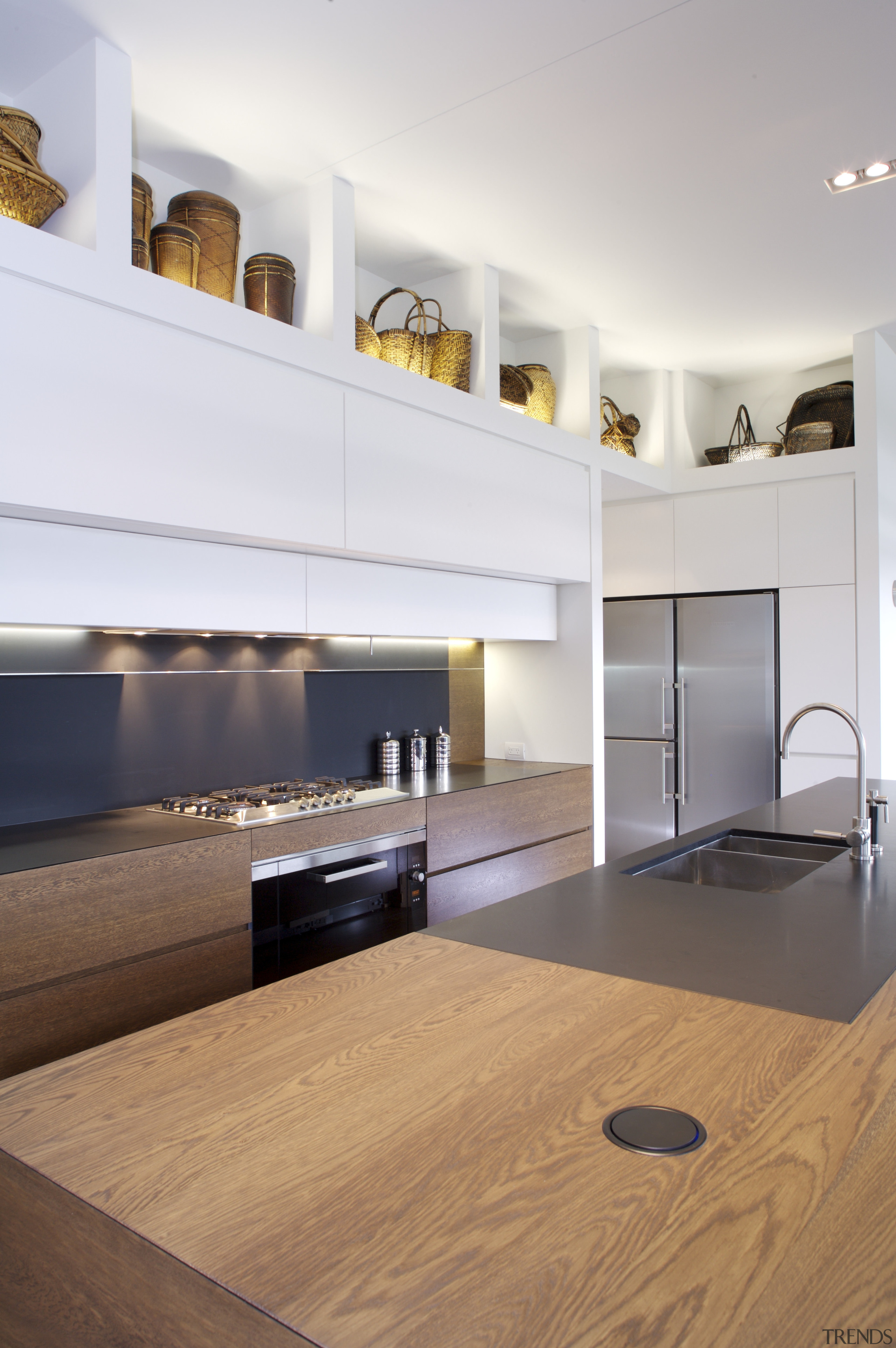 View of kitchen which features oak veneer island apartment, architecture, cabinetry, countertop, floor, flooring, hardwood, interior design, kitchen, laminate flooring, living room, room, wood, wood flooring, white