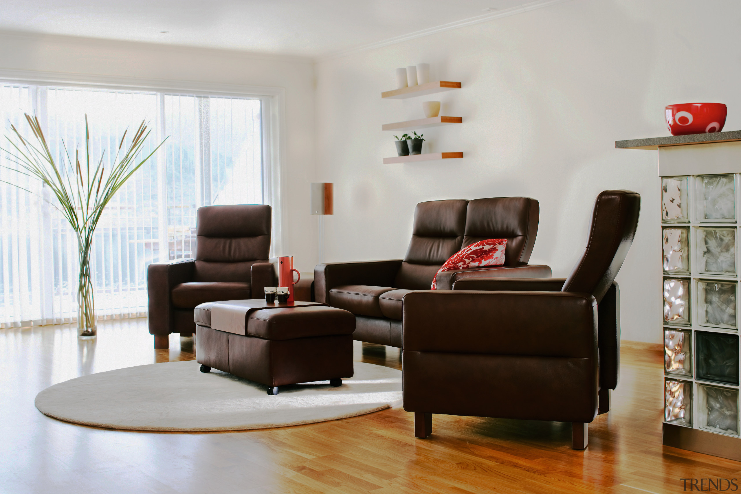 A view of ssome furniture from Scansin International. chair, couch, floor, furniture, home, interior design, living room, loveseat, recliner, room, table, gray