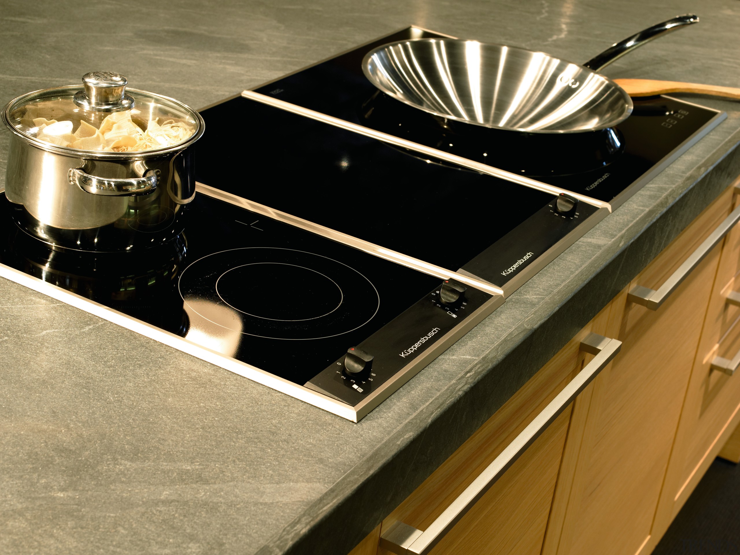 view of this  granite countertop  by cookware and bakeware, countertop, kitchen stove, sink, brown