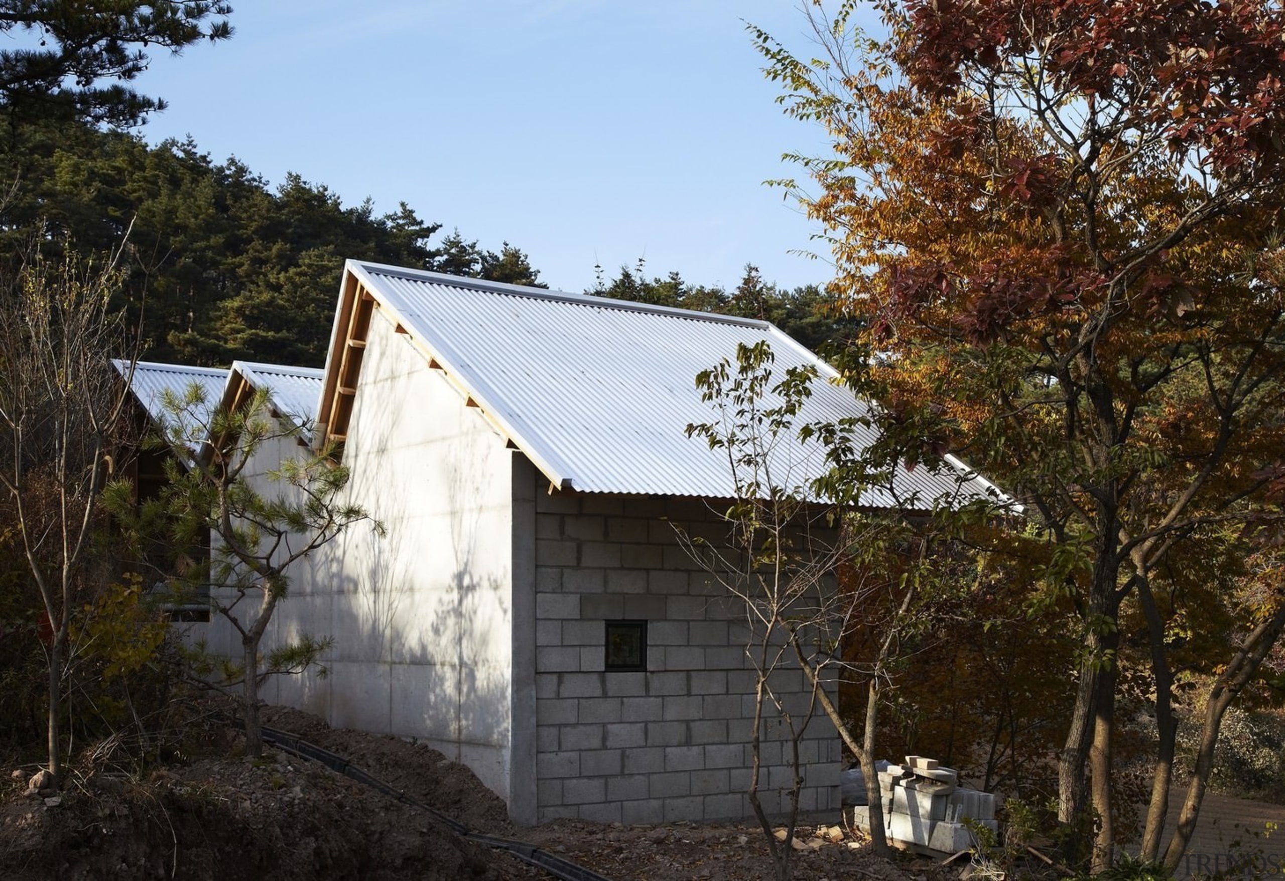 A gabled roof is throwback to older design barn, cottage, farmhouse, home, house, hut, property, real estate, roof, rural area, shack, shed, tree, wood, black