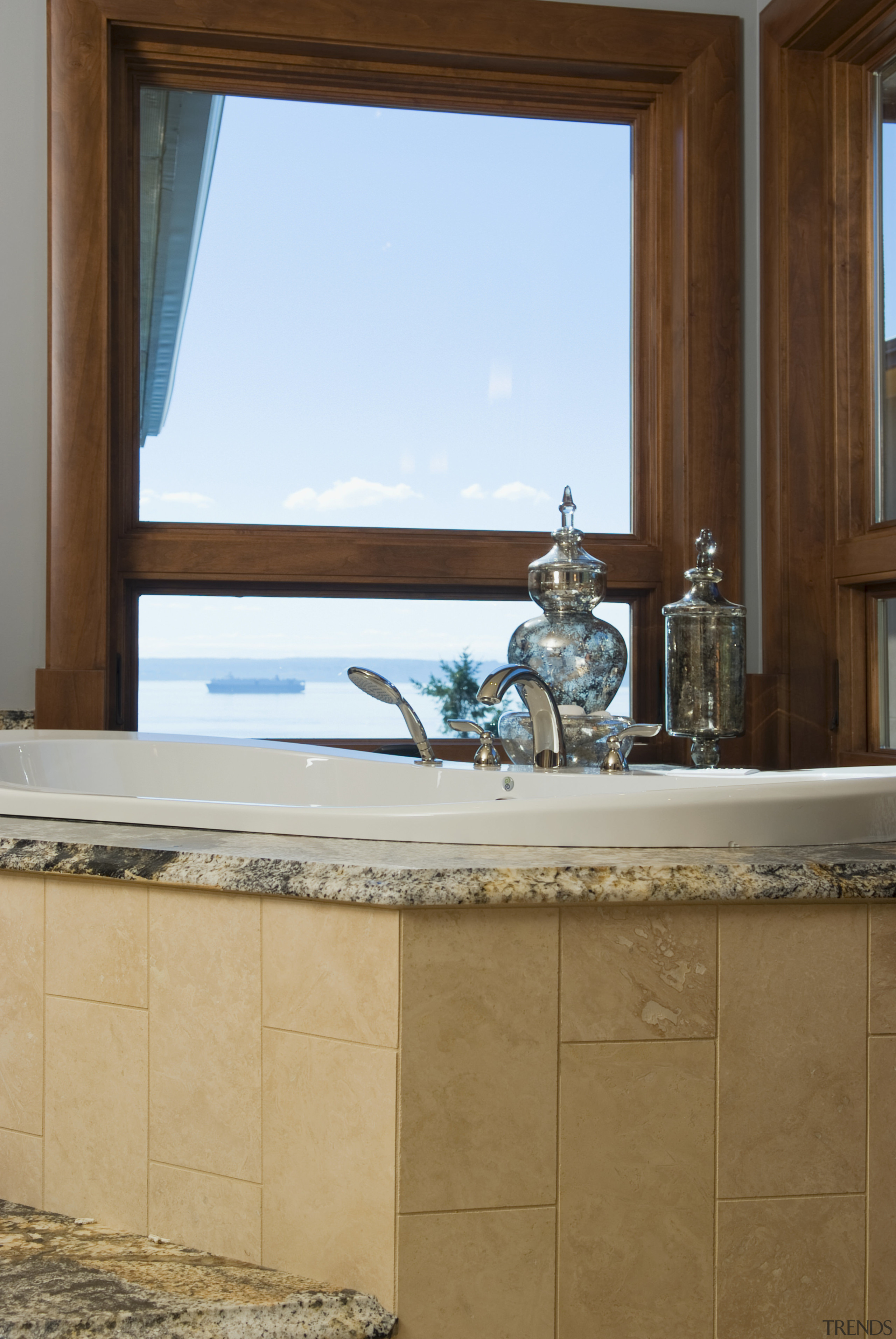 Pacific Crest Industries design and manufacture custom cabinetry bathroom, countertop, floor, flooring, home, interior design, room, sink, tile, wall, window, brown