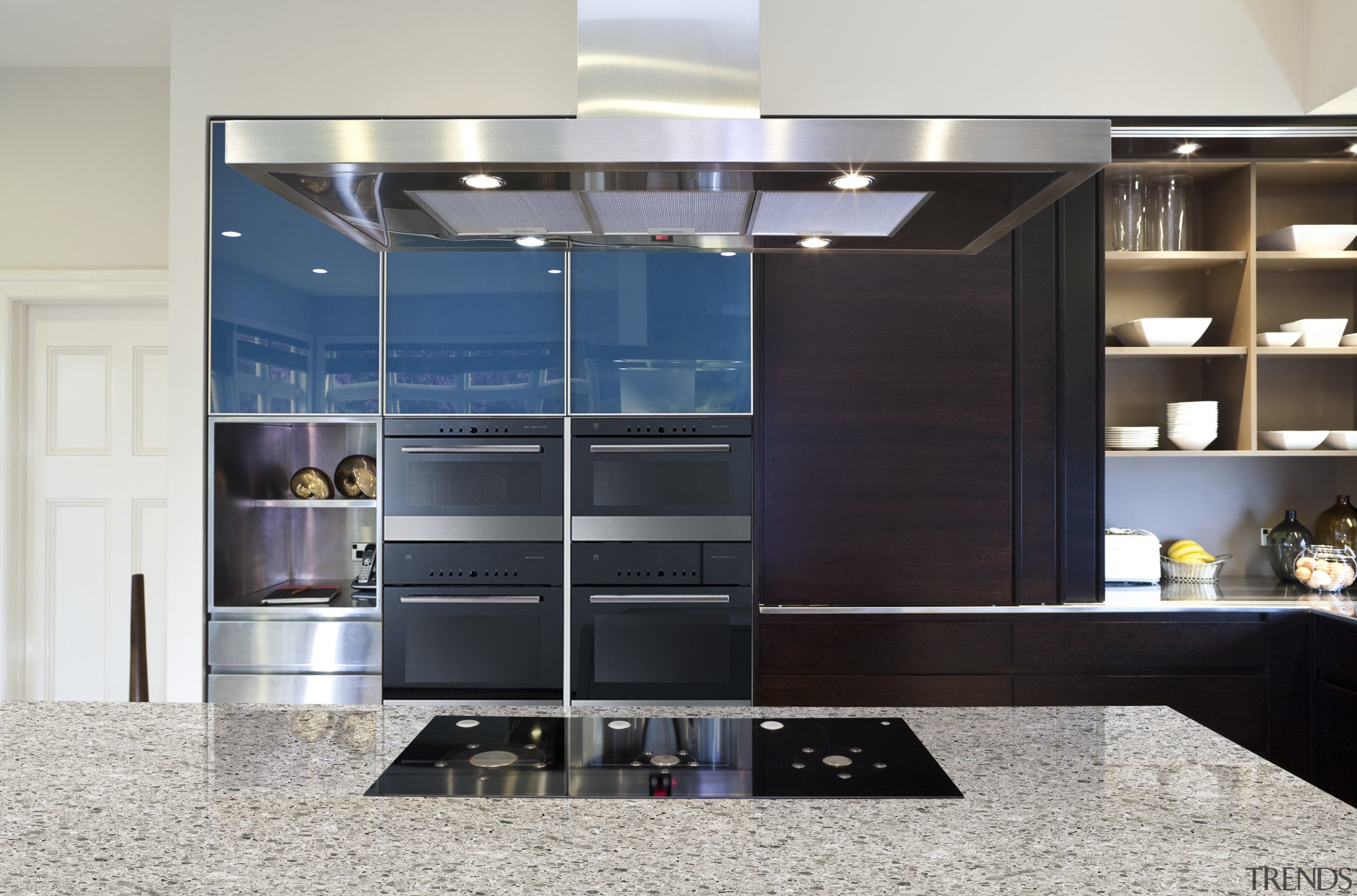 View of a contemporary kitchen which features appliances cabinetry, furniture, interior design, kitchen, gray, black