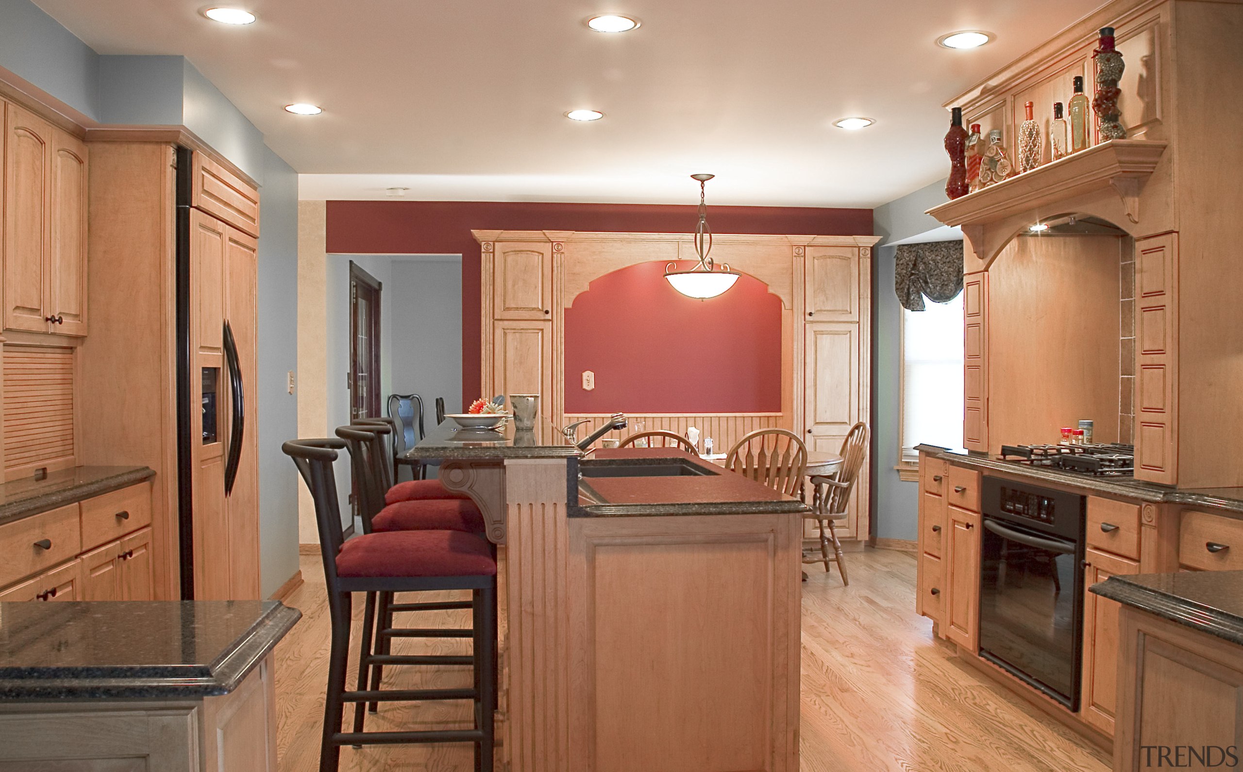 A view of this kitchen designed by Designer cabinetry, ceiling, countertop, cuisine classique, floor, flooring, hardwood, home, interior design, kitchen, real estate, room, wood flooring, orange, brown