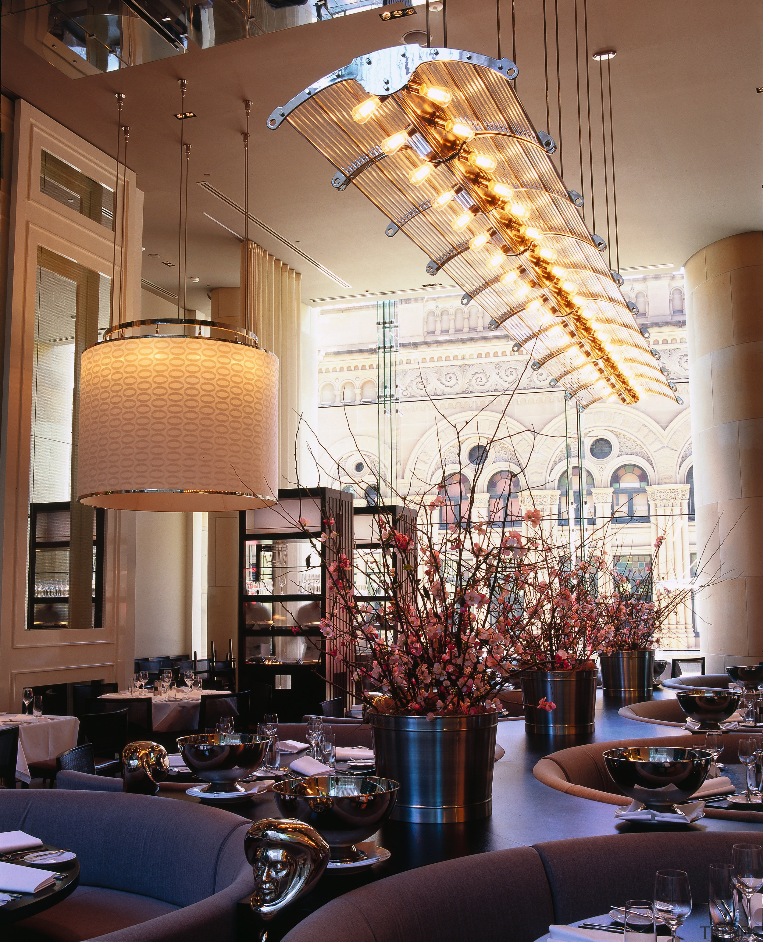 View of hotel restaurant with large curved overhead architecture, ceiling, chandelier, home, interior design, lighting, living room, lobby, window, brown