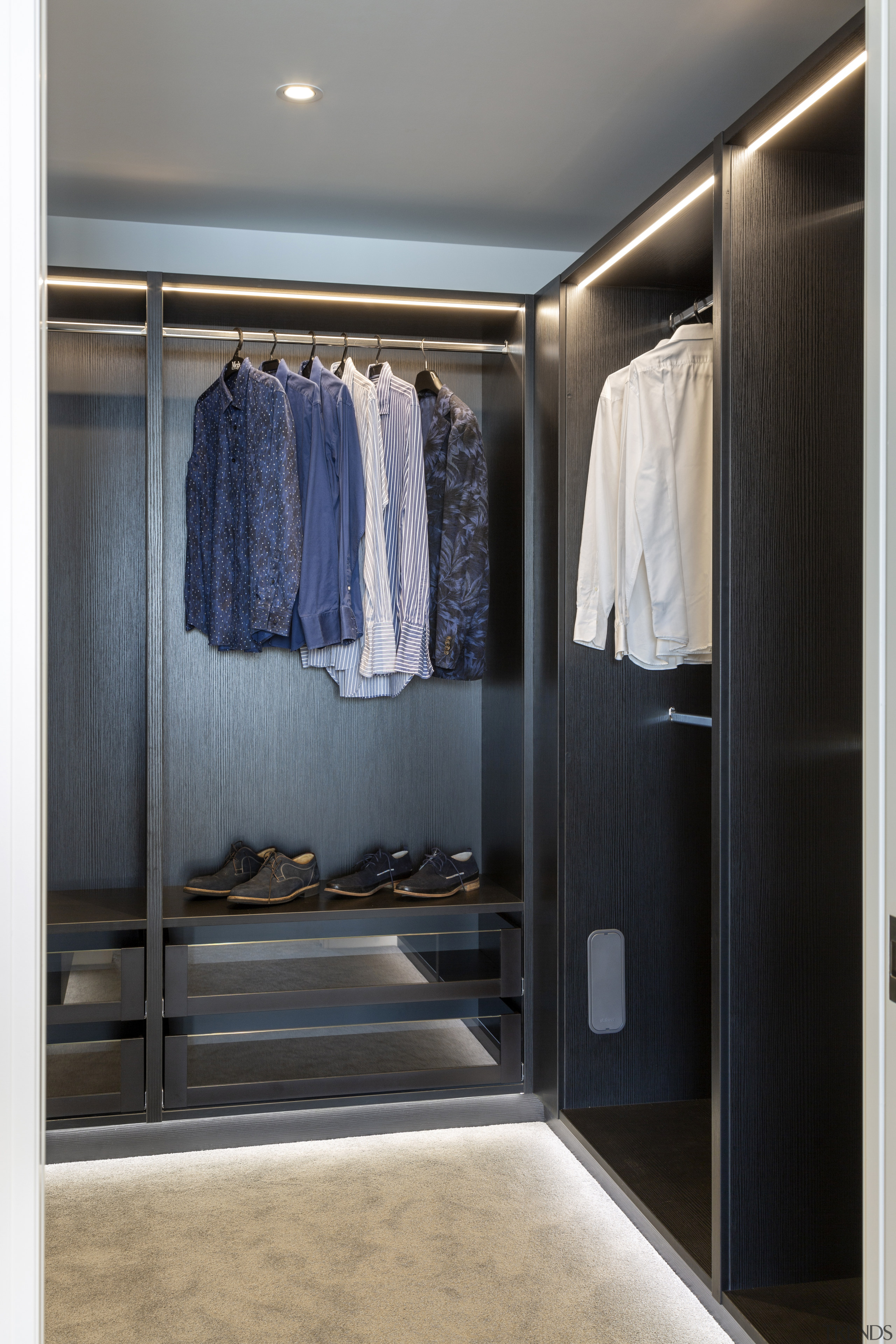 ​​​​​​​Finely crafted built-in cabinetry in this walk-in wardrobe 