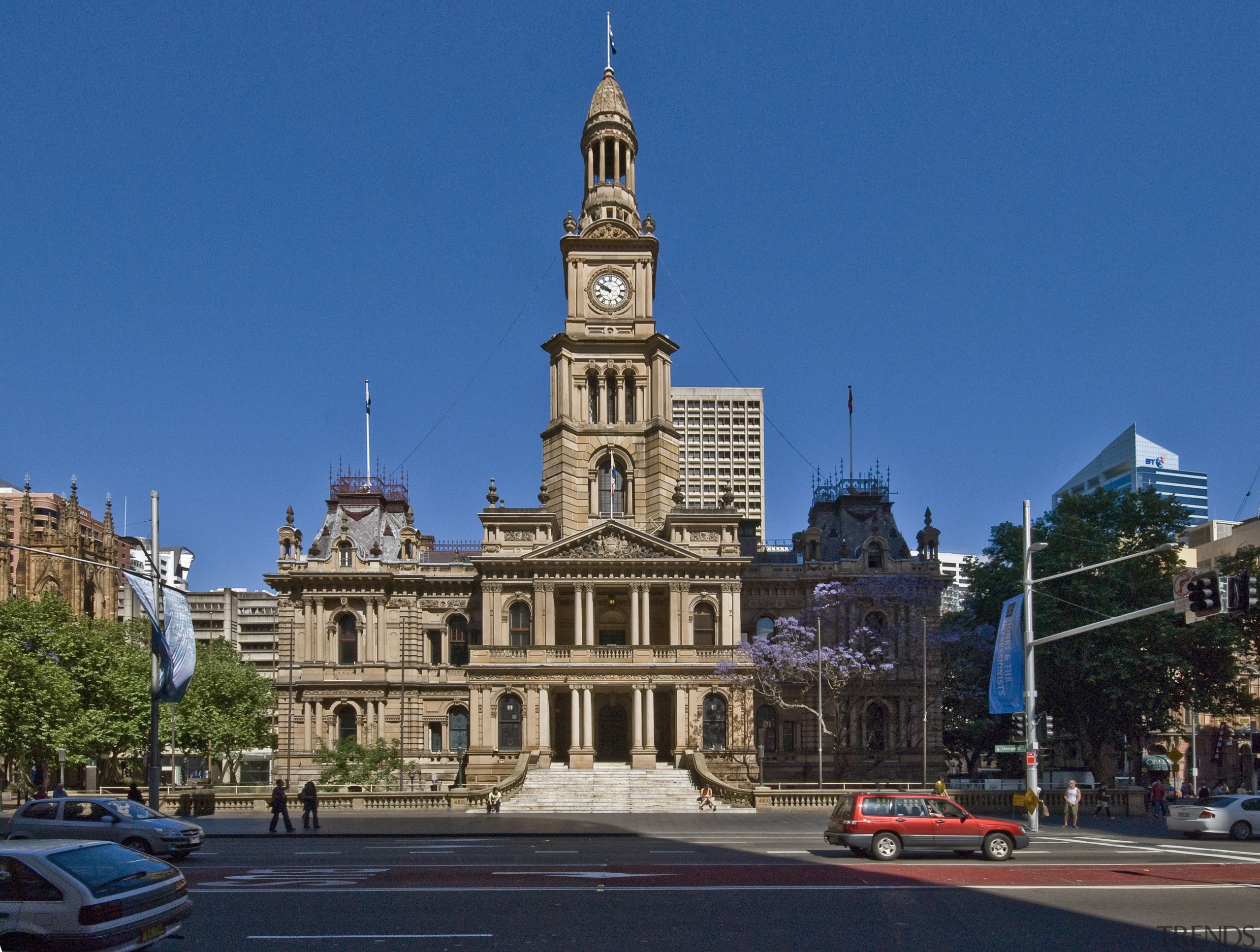 View of the renovated Sydney town hall featuring building, city, classical architecture, downtown, facade, landmark, metropolis, metropolitan area, plaza, seat of local government, sky, spire, steeple, tourist attraction, tower, town, town square, urban area, blue