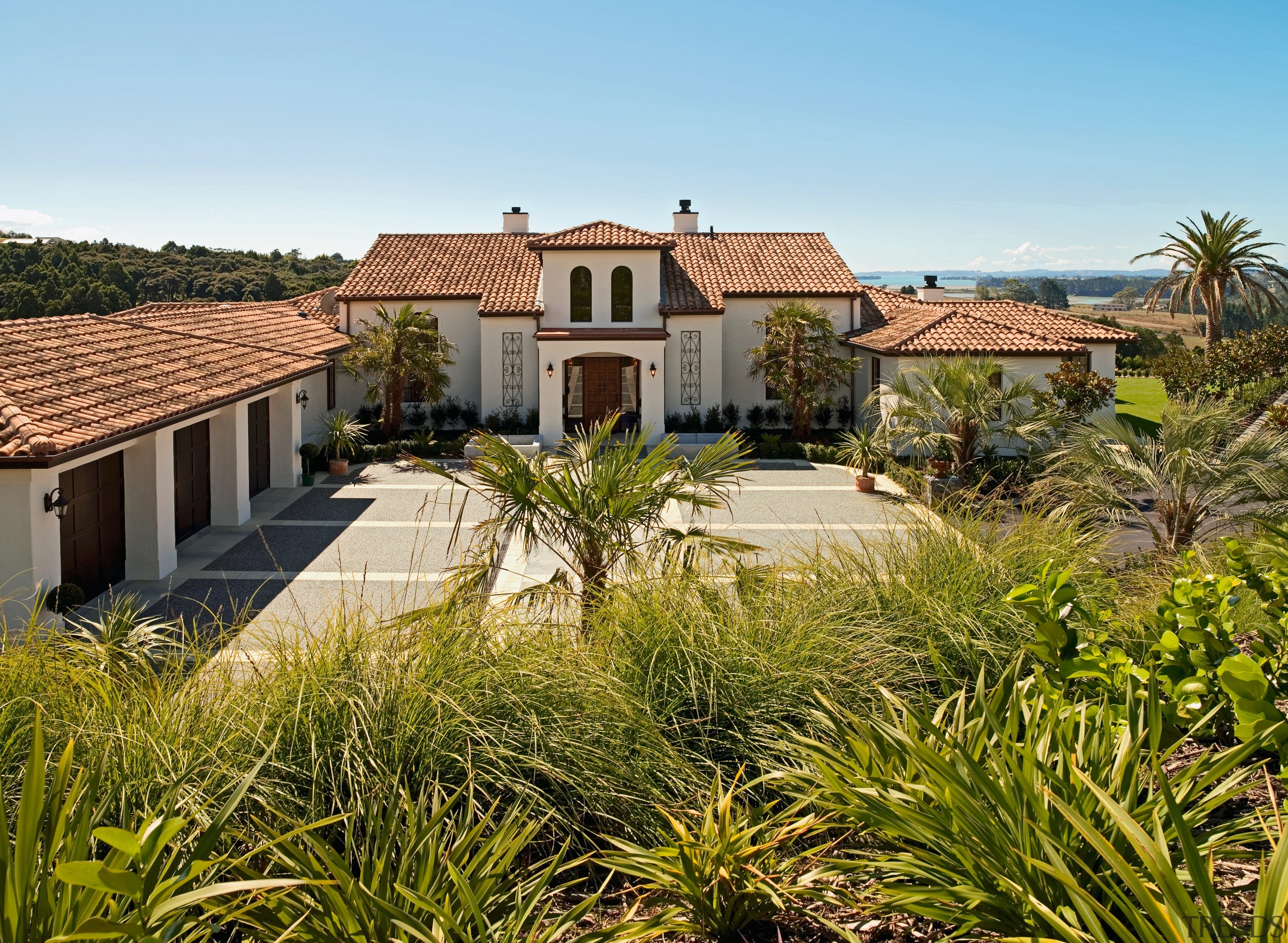 A view of a home using Espana Ceramics. arecales, cottage, estate, facade, farmhouse, hacienda, home, house, land lot, mansion, palm tree, property, real estate, residential area, roof, sky, villa, brown