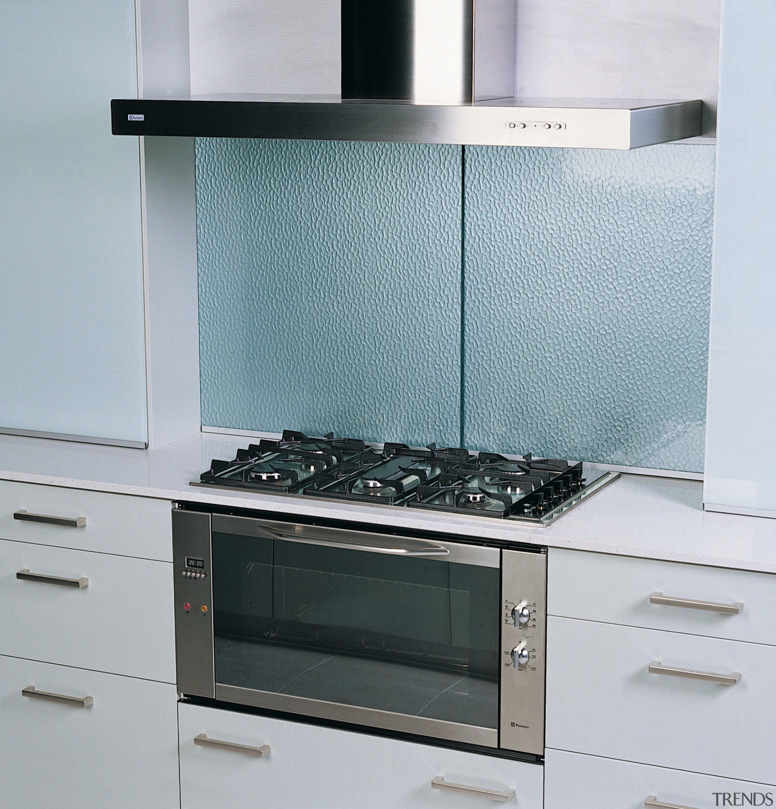 Kitchen with white cabinetry, cooktop, and stainless steel countertop, glass, home appliance, kitchen, kitchen appliance, kitchen stove, product, product design, gray