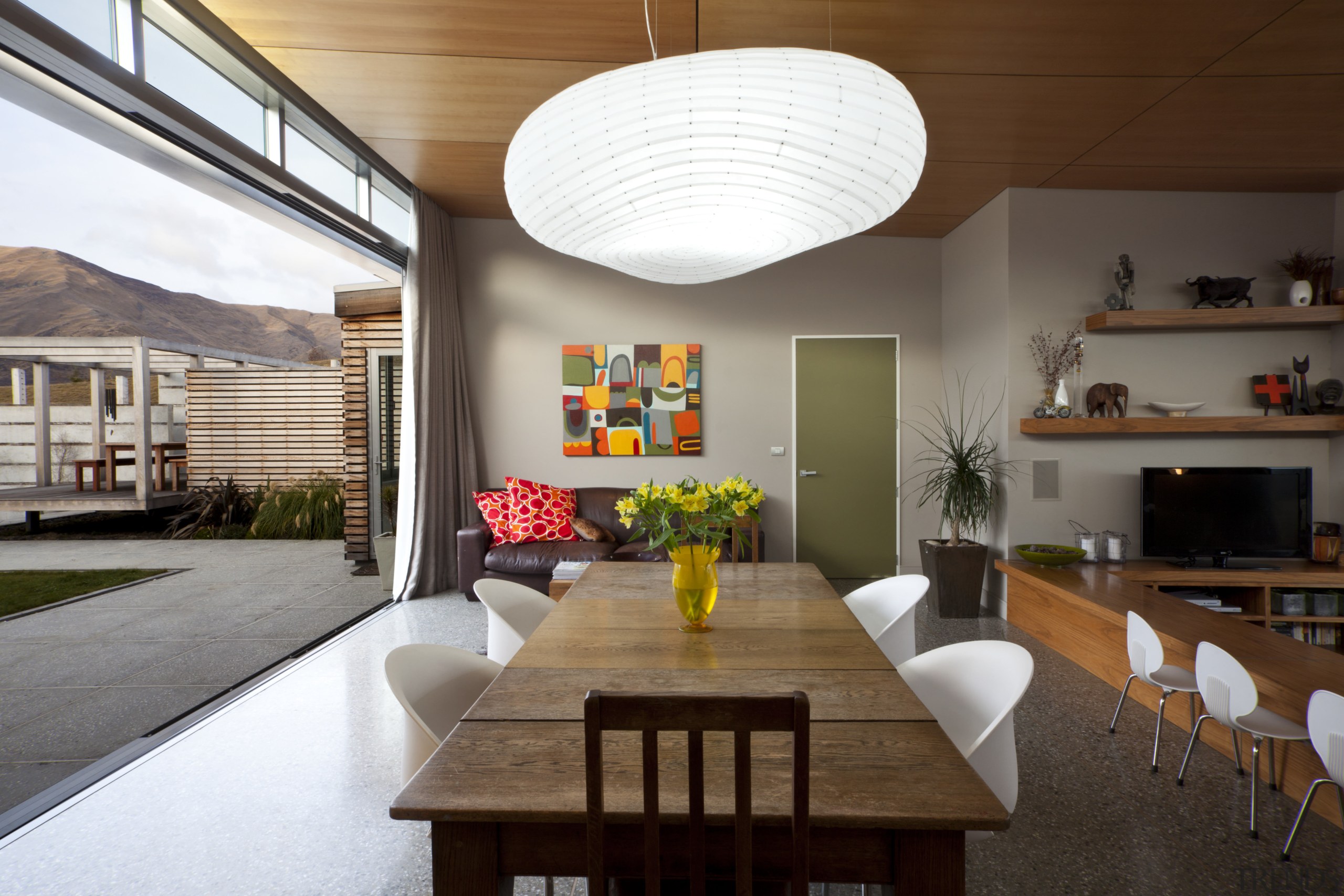 This home was designed by architect Nick Karlovsky. architecture, ceiling, dining room, house, interior design, living room, table, brown, gray