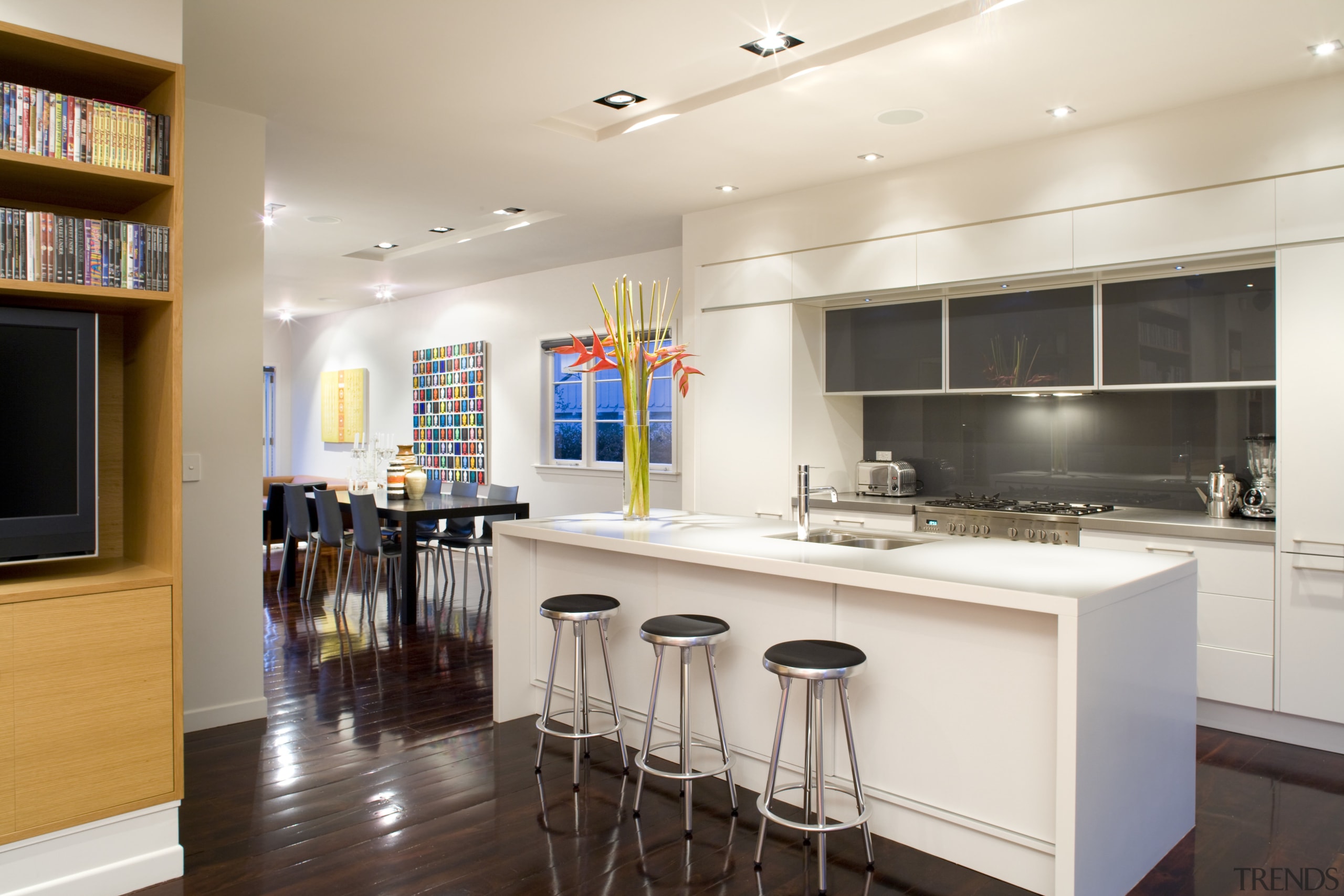 The kitchen has a symmetrical design, with a countertop, interior design, kitchen, real estate, room, white